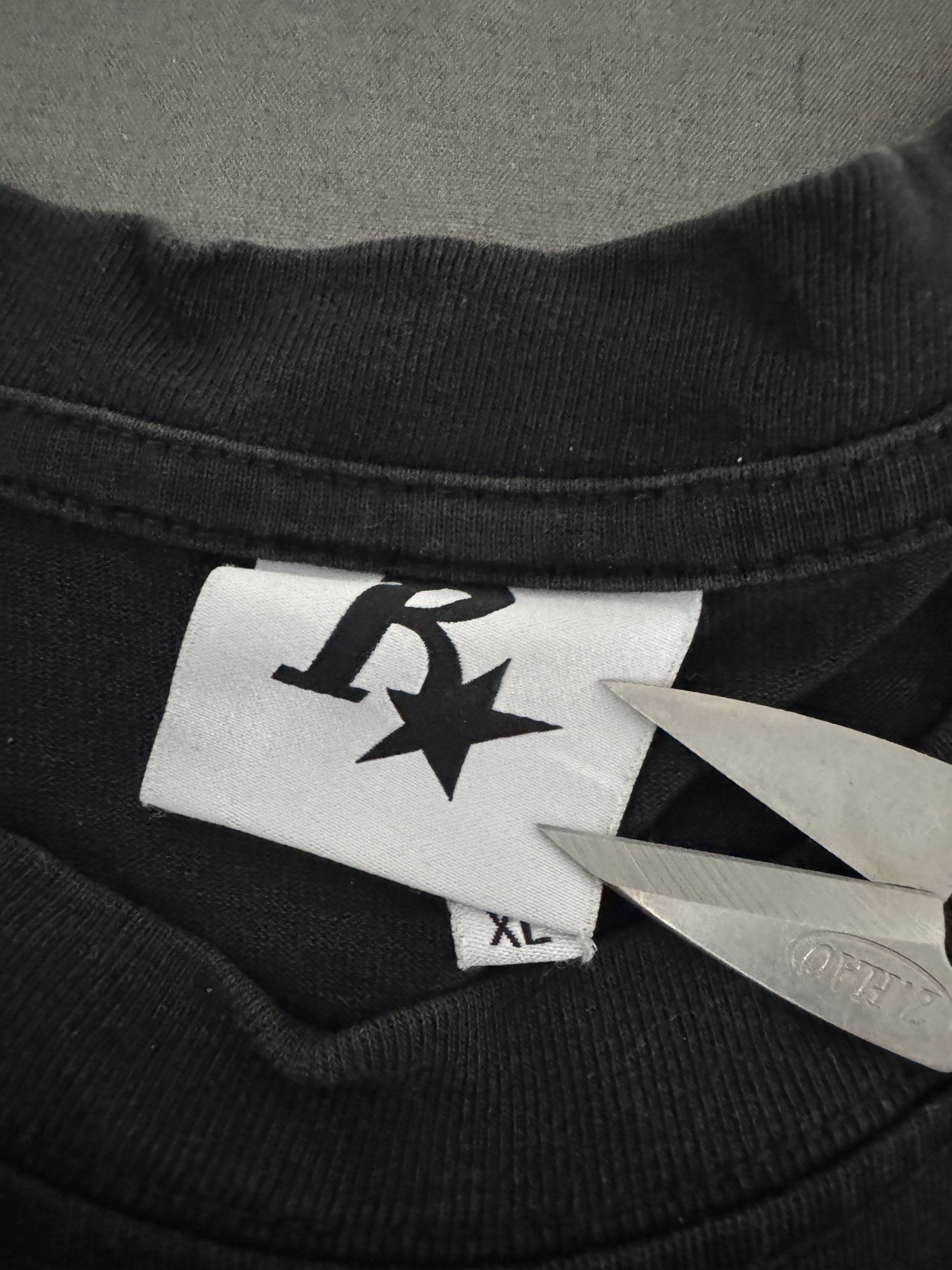 Rass Sta XL Black T-shirt (Category: Tshirts & Polo Shirts ) located in Manila. Submitted by jpabss (Listing ID 1420344164, Image 3). Description: 💥Black Rass Sta T-shirt 💥Design: Large white "R" and star on front and back 💥Condition: 9/10 💥Width: 22 💥Length: 28 💥Issue: Need Restitch on Left Side (I’ll Send Pic if interested).