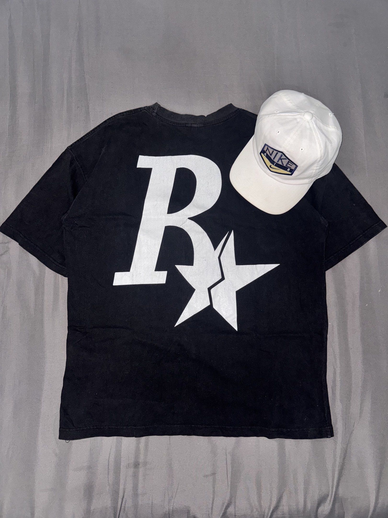 Rass Sta XL Black T-shirt (Category: Tshirts & Polo Shirts ) located in Manila. Submitted by jpabss (Listing ID 1420344164, Image 2). Description: 💥Black Rass Sta T-shirt 💥Design: Large white "R" and star on front and back 💥Condition: 9/10 💥Width: 22 💥Length: 28 💥Issue: Need Restitch on Left Side (I’ll Send Pic if interested).