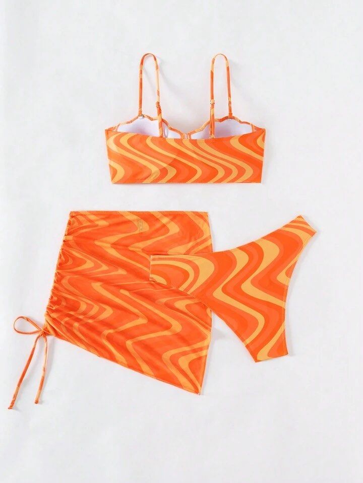 Shein Orange Allover Print Scallop Bikini Set (Category: Bikinis & Swimsuits) located in Cavite. Submitted by itsjameee (Listing ID 1420275830, Image 2). Description: - Orange swirl bikini set - Top: Adjustable straps, bustier style - Bottoms: High-cut - Some sets include a skirt with drawstring detail.