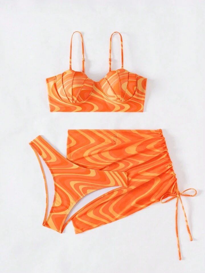 Shein Orange Allover Print Scallop Bikini Set (Category: Bikinis & Swimsuits) located in Cavite. Submitted by itsjameee (Listing ID 1420275830, Image 1). Description: - Orange swirl bikini set - Top: Adjustable straps, bustier style - Bottoms: High-cut - Some sets include a skirt with drawstring detail.