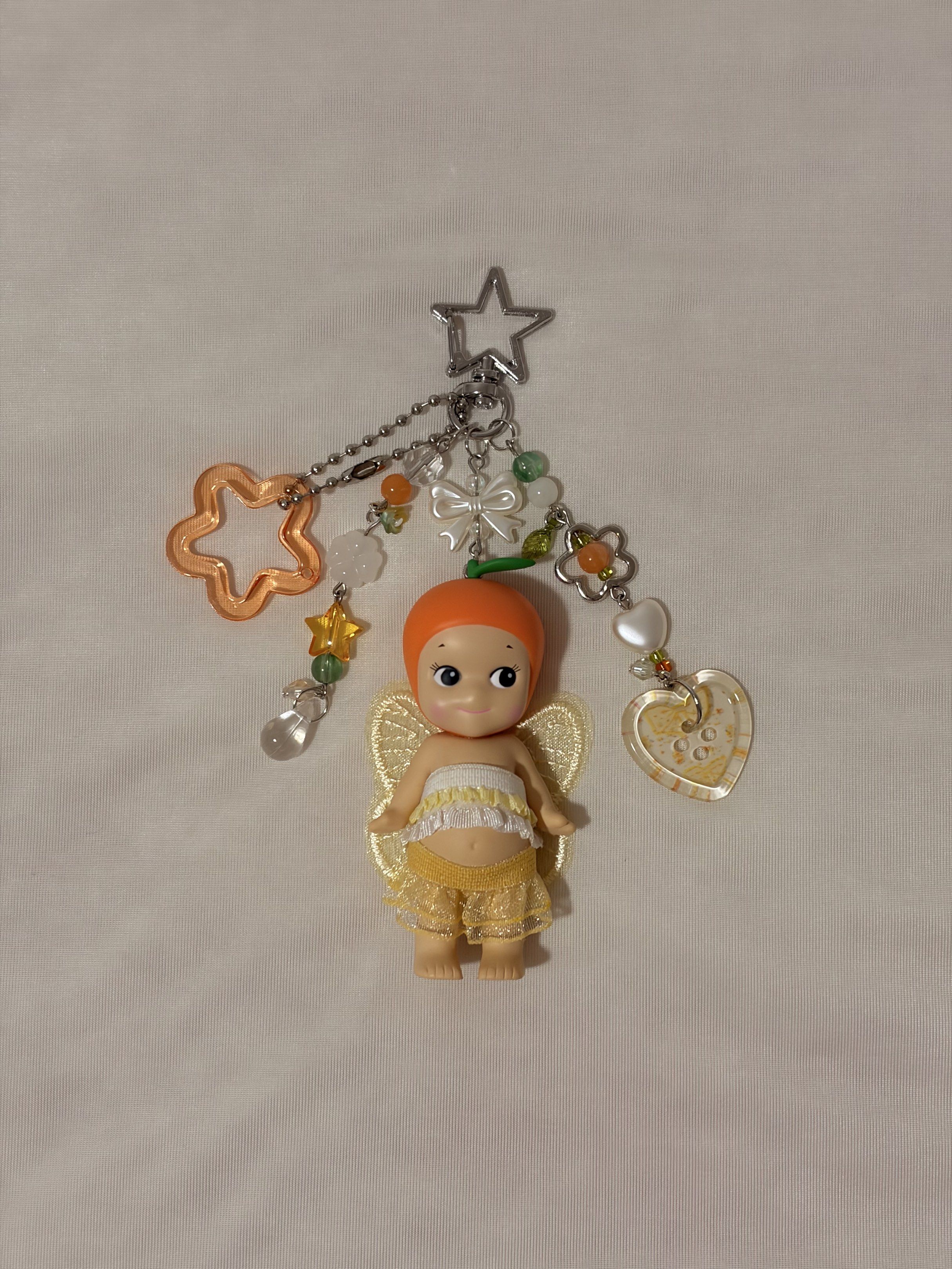 sonny angel keychain - fruit series (orange 🍊) (Category: Designer & Blind Box Toys) located in Singapore. Submitted by yun.st4r (Listing ID 1420344986, Image 1). Description: ⟡ wts sonny angel keychain fruit series (orange) .☘︎ ݁݁݁݁˖˚ ˚⊱ ⊰˚🍊 ⟡ get your lucky charm just in time for cny! 🧧 ⟡ tracked mail +3$ ⟡ self collection listed below!.