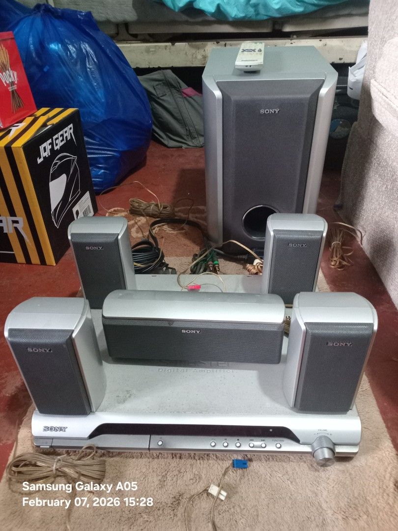 Sony Home Theater System (Category: Soundbars, Speakers & Amplifiers) located in Valenzuela. Submitted by consjavier74 (Listing ID 1420349111, Image 1). Description: - Sony home theater system - Multiple speakers and subwoofer included - Central unit with disc tray and control panel - Variety of speaker sizes (tall and compact) - Complete system with all necessary components - Cables included.