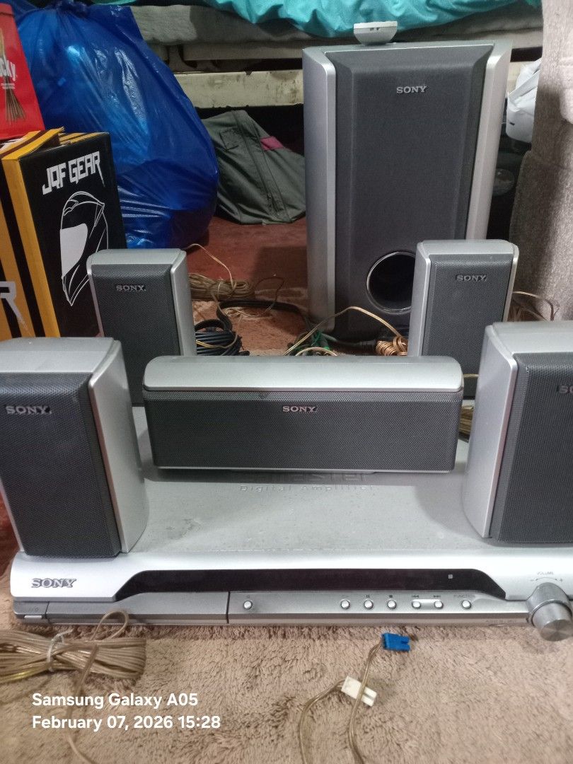 Sony Home Theater System (Category: Soundbars, Speakers & Amplifiers) located in Valenzuela. Submitted by consjavier74 (Listing ID 1420349111, Image 2). Description: - Sony home theater system - Multiple speakers and subwoofer included - Central unit with disc tray and control panel - Variety of speaker sizes (tall and compact) - Complete system with all necessary components - Cables included.