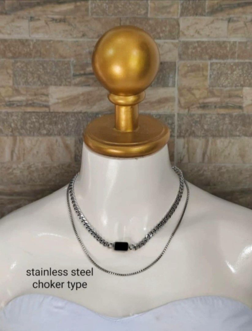 Stainless Steel Choker Necklace (Category: Necklaces) located in Subic. Submitted by caekheso_ (Listing ID 1420302564, Image 1). Description: - Stainless steel choker necklace - Layered design with box and curb chains - Black rectangular accent - Adjustable length for a comfortable fit - Features a "6steel" branded clasp Hypoallergenic: Generally safe for sensitive skin. Waterproof: It does not rust or tarnish when exposed to water. Highly Durabl