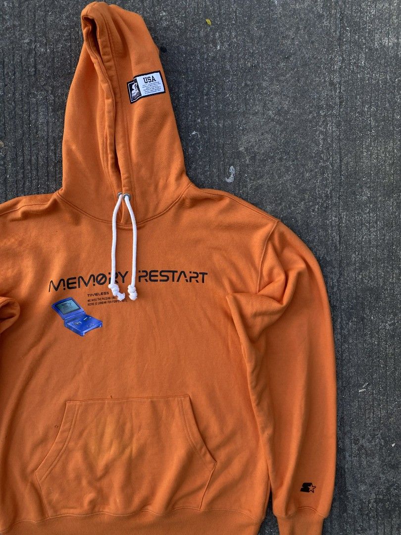 Starter Memory Restart Hoodie (Category: Hoodies) located in Manila. Submitted by thrift2something (Listing ID 1420345356, Image 2). Description: - Orange hoodie with "Memory Restart" graphic - Hood with drawstring - Front pocket - Starter logo on sleeve - Hood patch - Bright orange color.