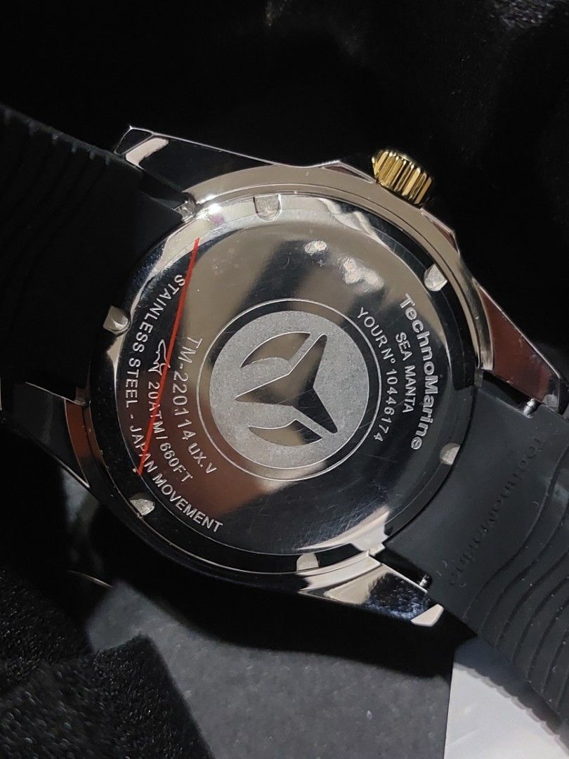 TechnoMarine Sea Manta Watch (Category: Men's Watches) located in Imus. Submitted by keenahsgiftshop (Listing ID 1420290135, Image 2). Description: - TechnoMarine Sea Manta watch - Black dial and gold-tone bezel - Black rubber strap with TechnoMarine logo - Date display - Water-resistant to 20ATM/650FT - Stainless steel back (Model: TM-220114) - Includes original box Techn0Marine Sea Manta Men's Silicone Strap ▪︎ 42mm, water resistant ▪︎ Caliber: