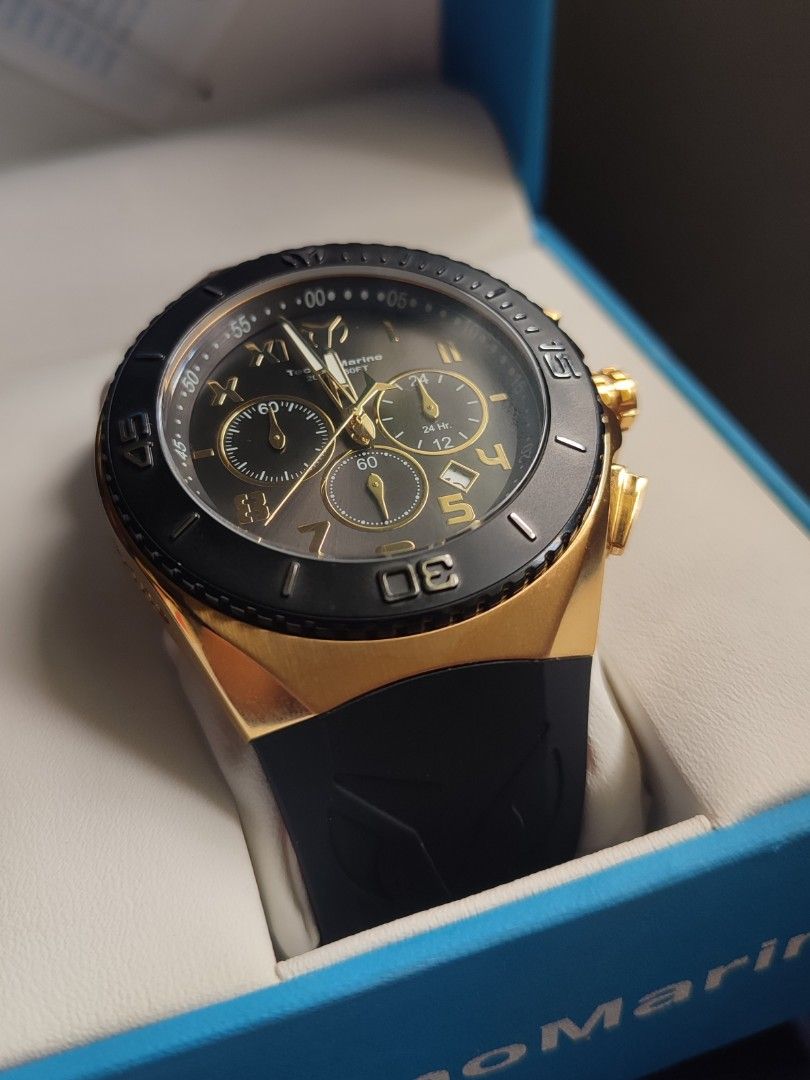 TechnoMarine TM-215066 Chronograph Watch (Category: Men's Watches) located in San Jose. Submitted by andreagarcia_ (Listing ID 1420220171, Image 1). Description: - TechnoMarine chronograph watch - Black and gold-tone design - Black bezel with gold accents - Black rubber strap - Gold-tone case - Multiple sub-dials - Date display - TechnoMarine logo and model information on the back - Comes with original box and warranty card 5,500 + lsf Never been