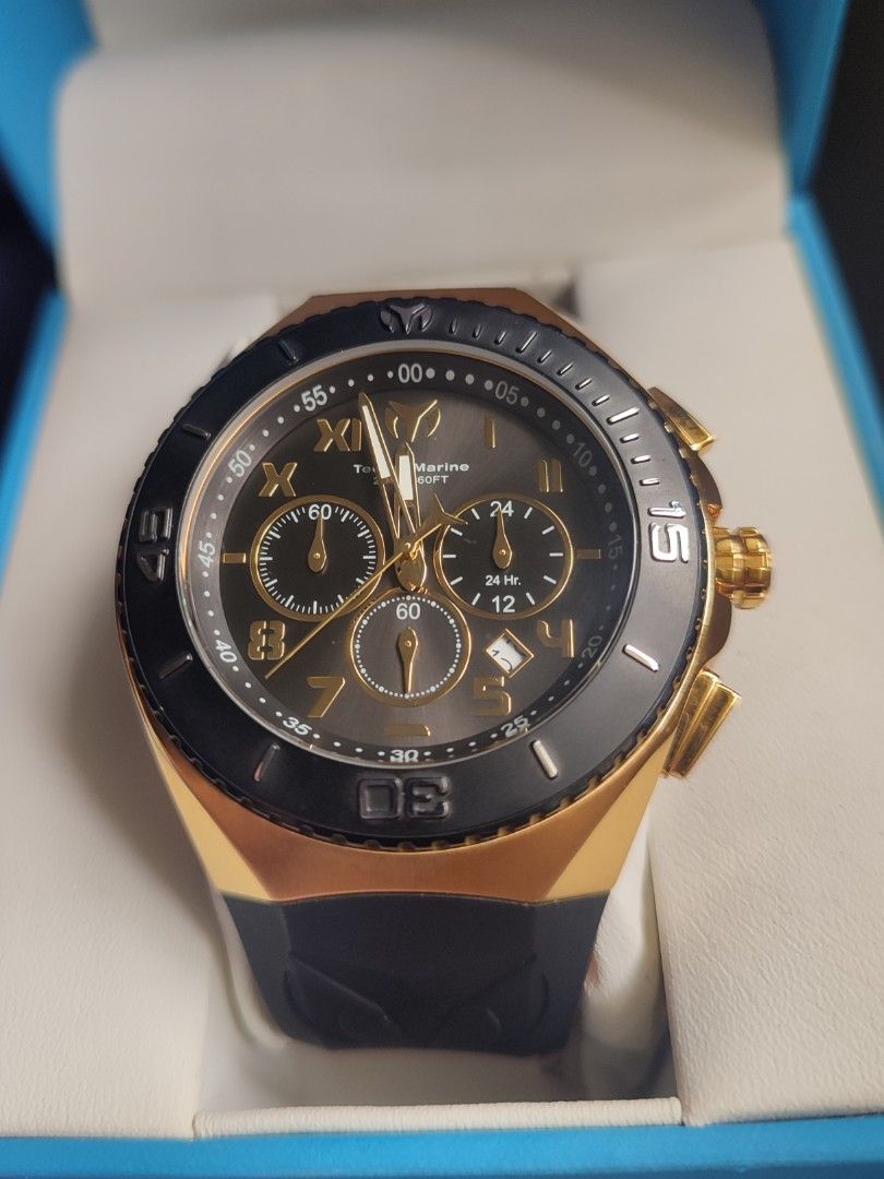 TechnoMarine TM-215066 Chronograph Watch (Category: Men's Watches) located in San Jose. Submitted by andreagarcia_ (Listing ID 1420220171, Image 2). Description: - TechnoMarine chronograph watch - Black and gold-tone design - Black bezel with gold accents - Black rubber strap - Gold-tone case - Multiple sub-dials - Date display - TechnoMarine logo and model information on the back - Comes with original box and warranty card 5,500 + lsf Never been