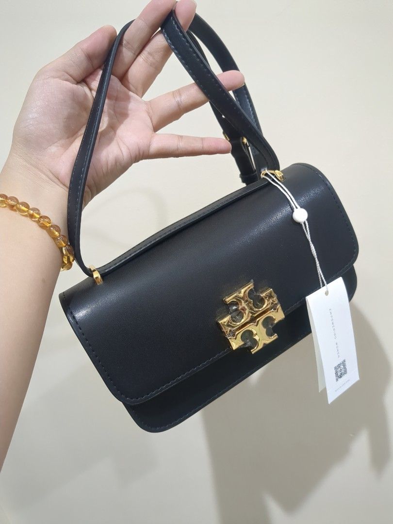 Tory Burch Small Eleanor Rectangular Bag (Category: Luxury Bags & Wallets) located in Las Pinas. Submitted by luxlahvu2017 (Listing ID 1420273501, Image 1). Description: - Tory Burch Small Eleanor Rectangular Bag - Black leather - Gold-tone logo and zipper - Detachable shoulder strap - Light brown fabric lining - Brand new with tag.
