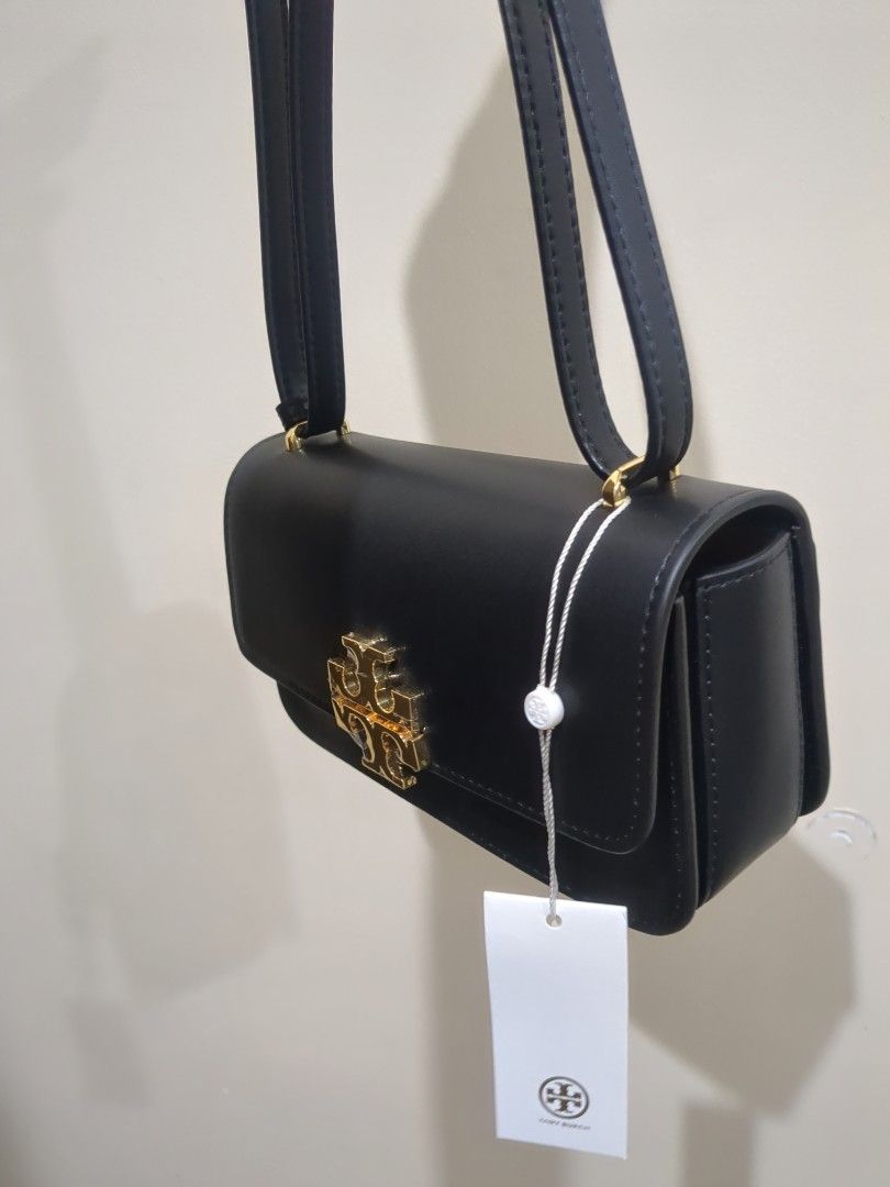 Tory Burch Small Eleanor Rectangular Bag (Category: Luxury Bags & Wallets) located in Las Pinas. Submitted by luxlahvu2017 (Listing ID 1420273501, Image 3). Description: - Tory Burch Small Eleanor Rectangular Bag - Black leather - Gold-tone logo and zipper - Detachable shoulder strap - Light brown fabric lining - Brand new with tag.