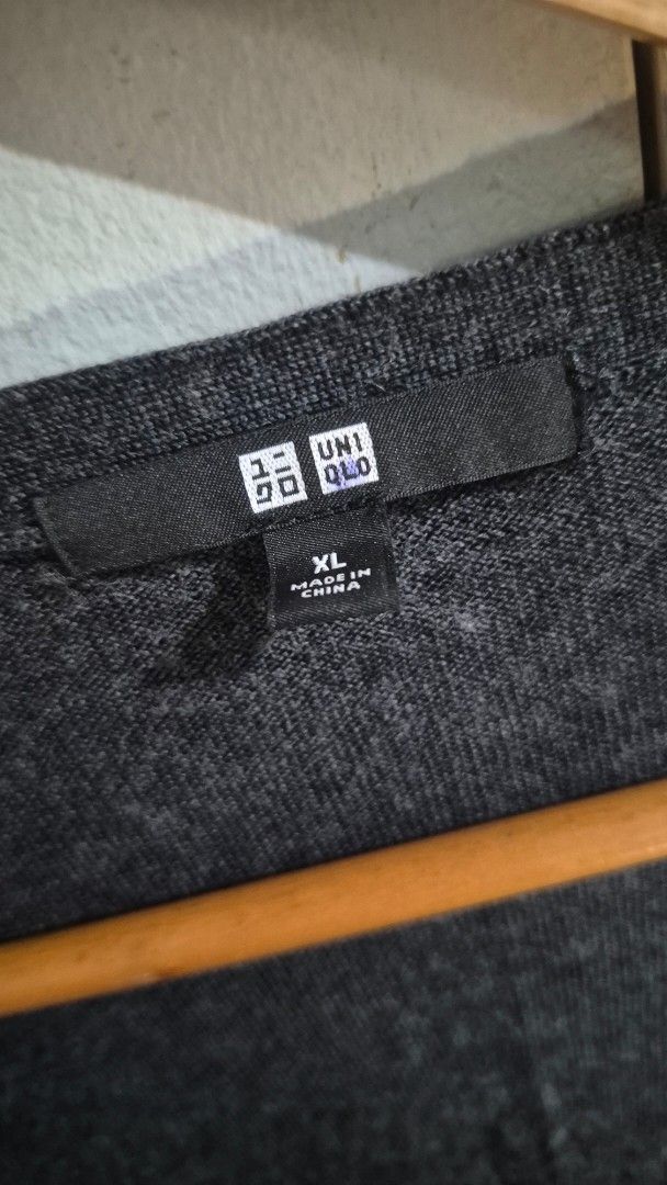 Uniqlo Wool Sweater XL (Category: Coats, Jackets and Outerwear) located in Manila. Submitted by declutter_s (Listing ID 1420297174, Image 3). Description: - Uniqlo wool sweater - Color: Dark grey - Features button detail - Size: XL (Bust 92-98 cm, 165/92A) - Material: 100% wool - Made in China.