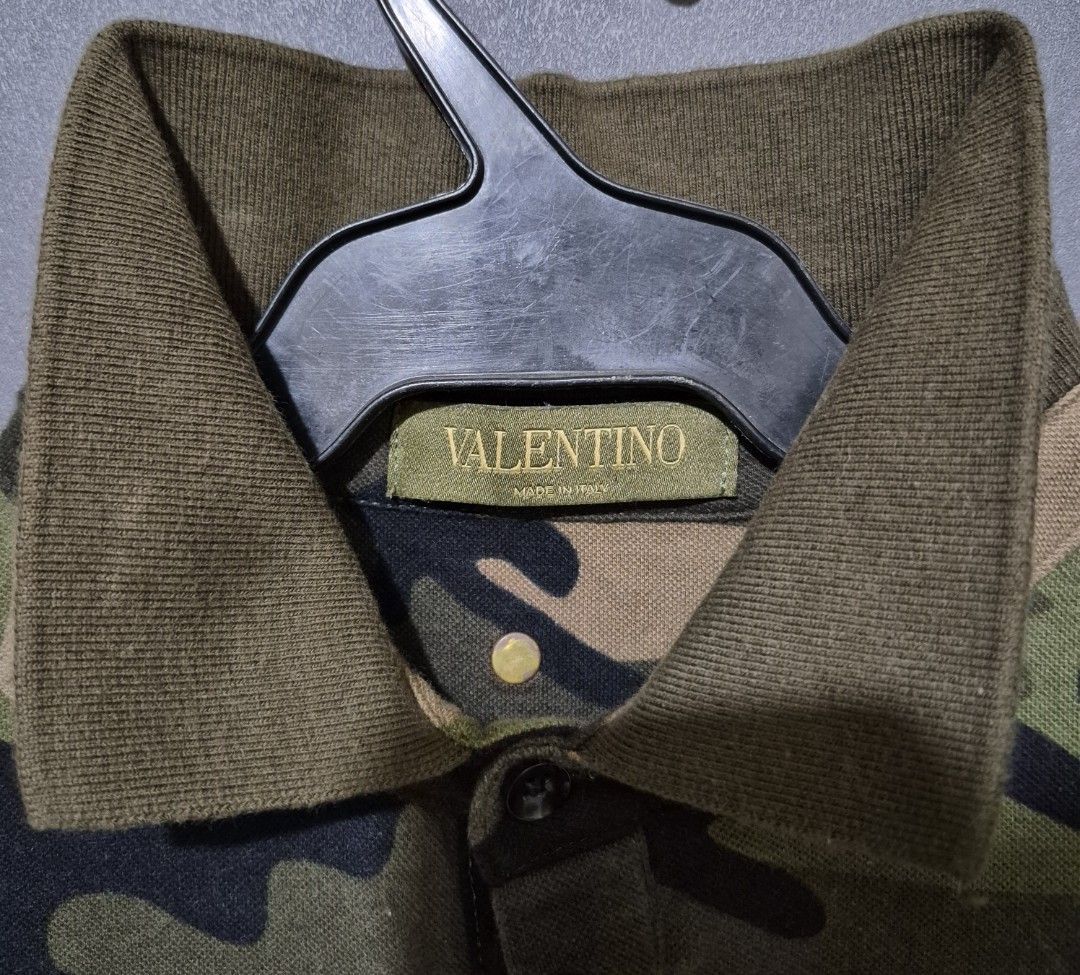 VALENTINO ROCKSTUD CAMO POLO SHIRT (Category: Tshirts & Polo Shirts ) located in Manila. Submitted by mkalelx (Listing ID 1420228295, Image 2). Description: FOR SALE: VALENTINO ROCKSTUD CAMO POLO SHIRT •1,500PHP •Authentic •Size: Small •W: 20 •L: 24 •Color Rate: 9.5/10 •No major flaw •Location: Antipolo •Meetup: Robinsons Antipolo •Can ship via LBC, Lalamove, J&T. •Buyer shoulders the shipping fee. •Condition: This previously owned and used item 