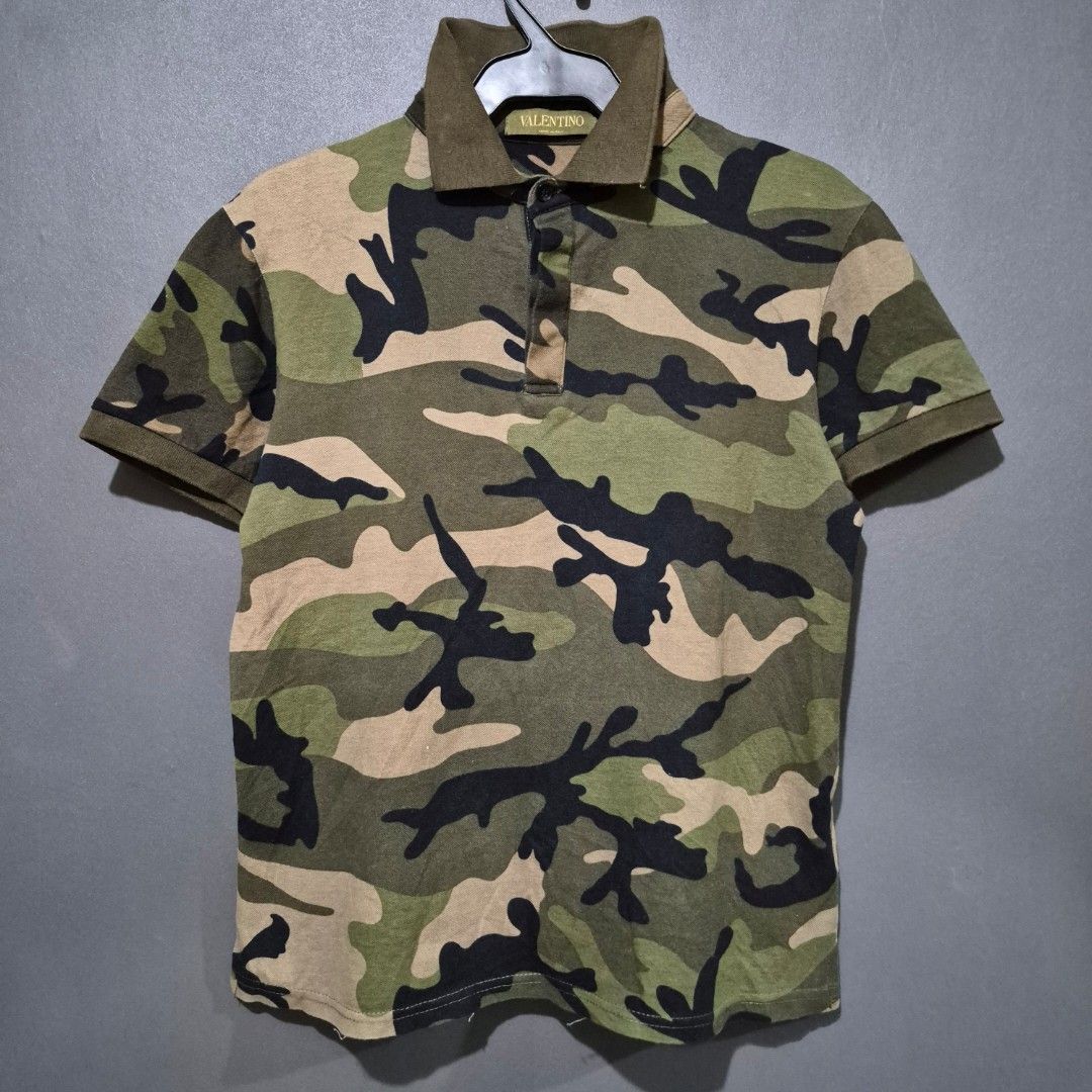 VALENTINO ROCKSTUD CAMO POLO SHIRT (Category: Tshirts & Polo Shirts ) located in Manila. Submitted by mkalelx (Listing ID 1420228295, Image 1). Description: FOR SALE: VALENTINO ROCKSTUD CAMO POLO SHIRT •1,500PHP •Authentic •Size: Small •W: 20 •L: 24 •Color Rate: 9.5/10 •No major flaw •Location: Antipolo •Meetup: Robinsons Antipolo •Can ship via LBC, Lalamove, J&T. •Buyer shoulders the shipping fee. •Condition: This previously owned and used item 