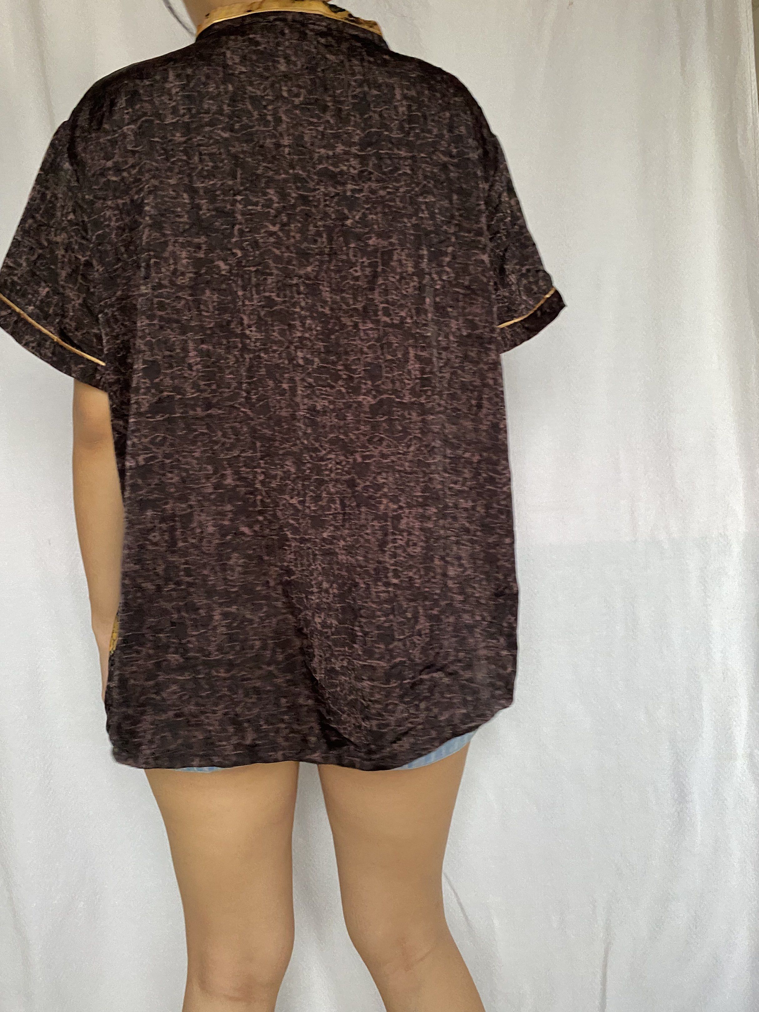 Vintage Chinese Style Top frog buttons (Category: Blouses) located in Tarlac. Submitted by himesells (Listing ID 1420241228, Image 3). Description: - Vintage top - Mandarin collar and short sleeves - Unique design: brown patterned fabric on one side, black fabric with gold floral and bird patterns on the other - Red button closures - Stylish and unique look.
