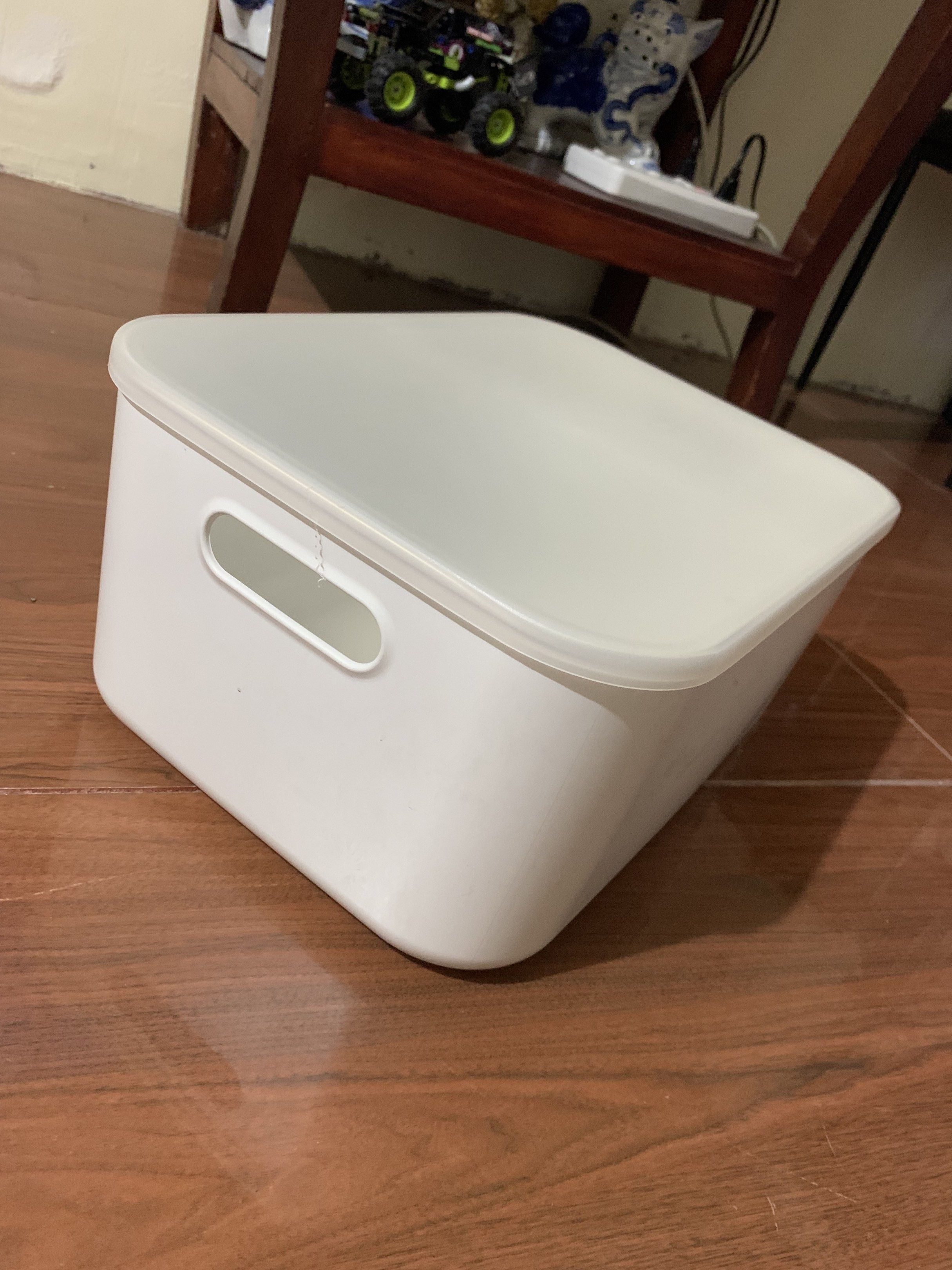 White Storage Box with Lid (Category: Storage Boxes & Baskets) located in Cavite. Submitted by sailormoon83 (Listing ID 1420302646, Image 1). Description: - White storage box with lid - Rectangular shape with rounded corners - Integrated handles for easy carrying - Durable plastic construction - Ideal for home and office organization - Snug-fitting lid.