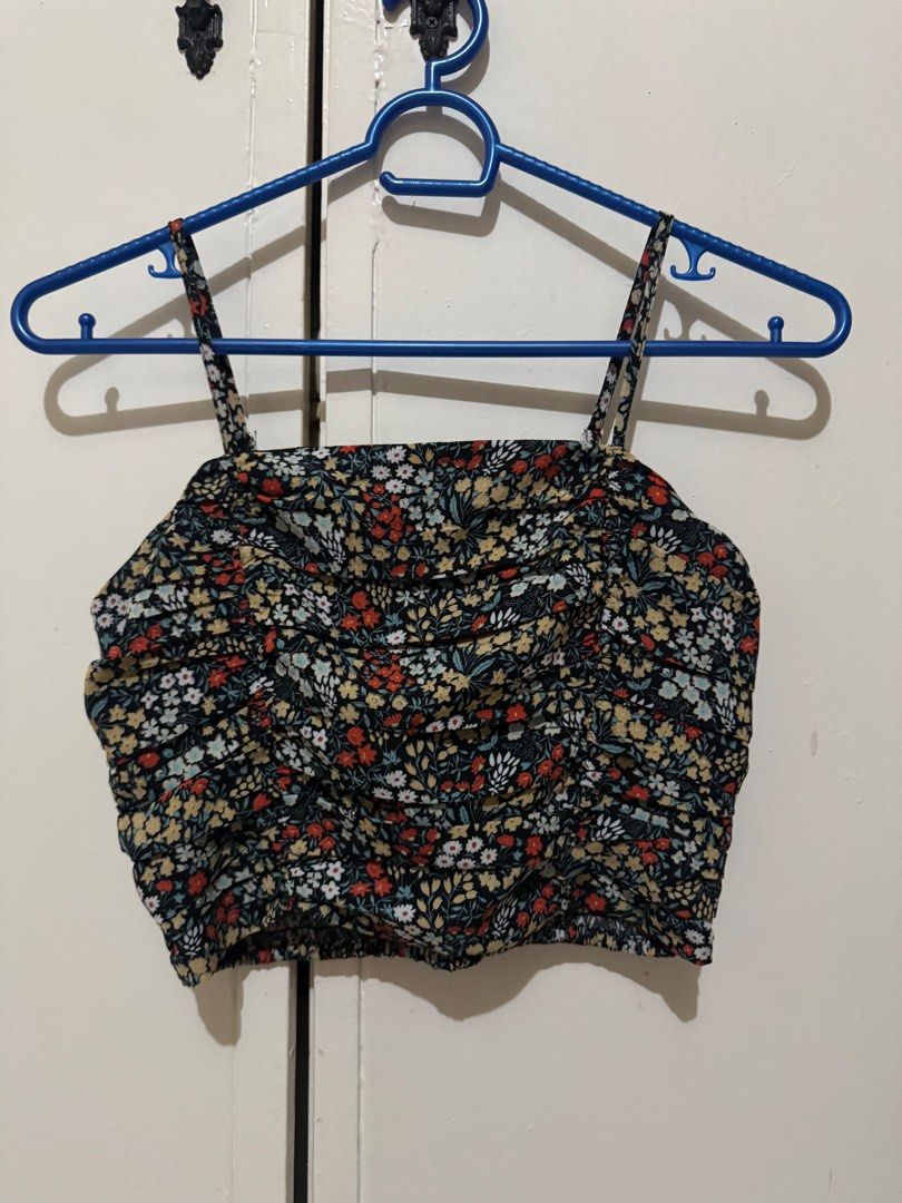 Zalora Basics Floral Crop Top (Category: Others Tops) located in Quezon City. Submitted by brandsetcph (Listing ID 1420303110, Image 1). Description: - Lorb Basics Floral Crop Top - Size: M - Design: Square neckline, adjustable straps, ruched front - Comfort: Smocked back for a flexible fit - Pattern: Colorful floral print on a black background.