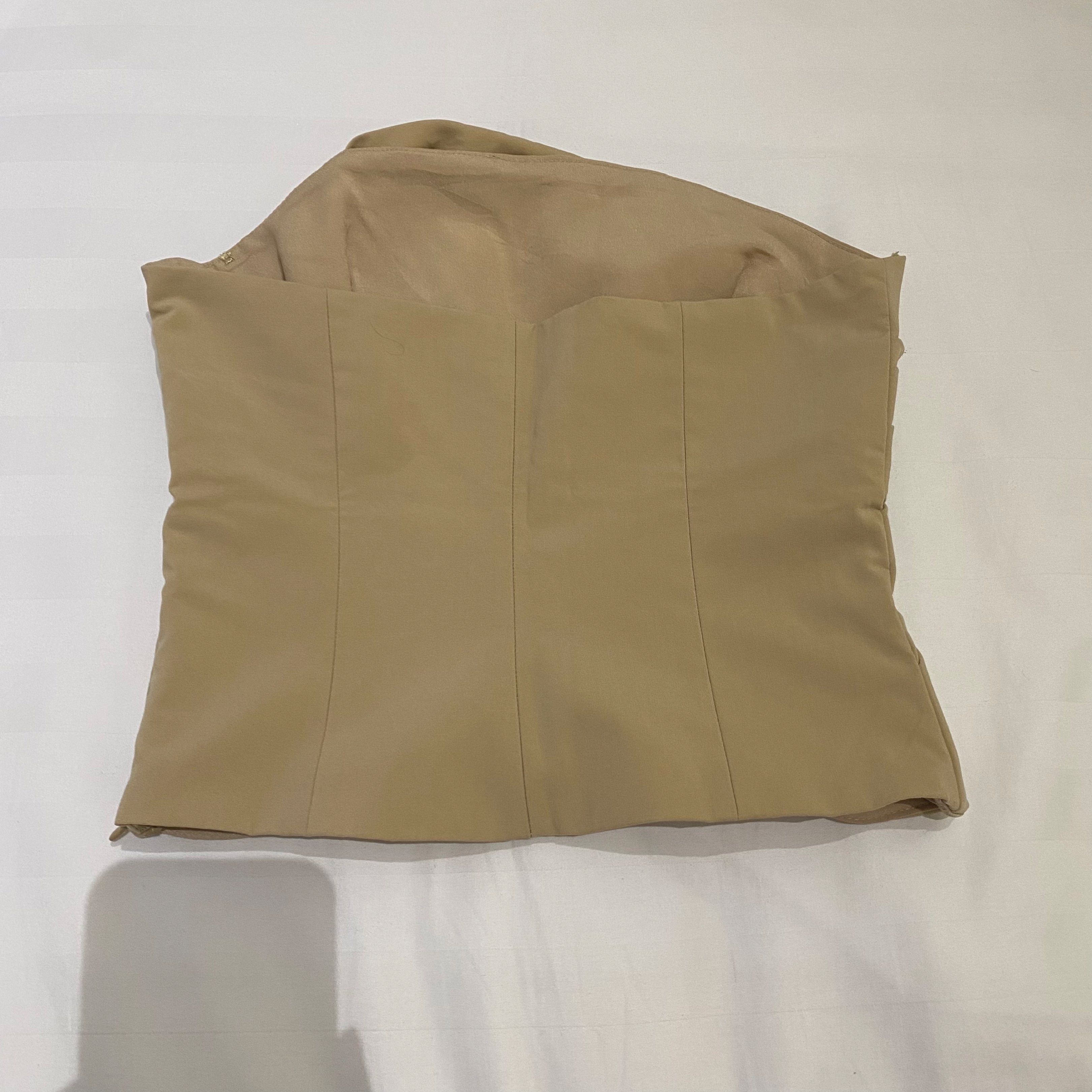 Zara Tube Top - XS (Category: Sleeveless) located in Manila. Submitted by sbpklover (Listing ID 1420263369, Image 2). Description: - Zara strapless top - Size: XS - Color: Beige - Design: Draped - Features: Side zipper, vertical back seams - Fabric: Smooth, woven material.