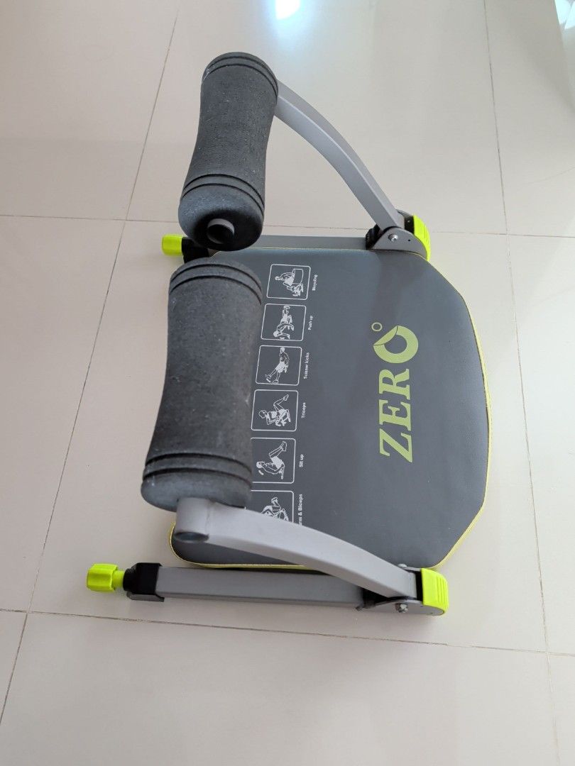 Zero Exercise Machine - Abdominal Workout (Category: Cardio & Fitness Machines) located in Singapore. Submitted by kuriomeow (Listing ID 1420237921, Image 2). Description: Zero exercise machine is designed for abdominal workouts. It features padded handles and a comfortable seat. The machine has illustrations for various exercises, including bicycling, push-ups, and sit-ups..
