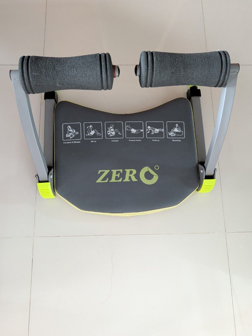 Zero Exercise Machine - Abdominal Workout (Category: Cardio & Fitness Machines) located in Singapore. Submitted by kuriomeow (Listing ID 1420237921, Image 1). Description: Zero exercise machine is designed for abdominal workouts. It features padded handles and a comfortable seat. The machine has illustrations for various exercises, including bicycling, push-ups, and sit-ups..