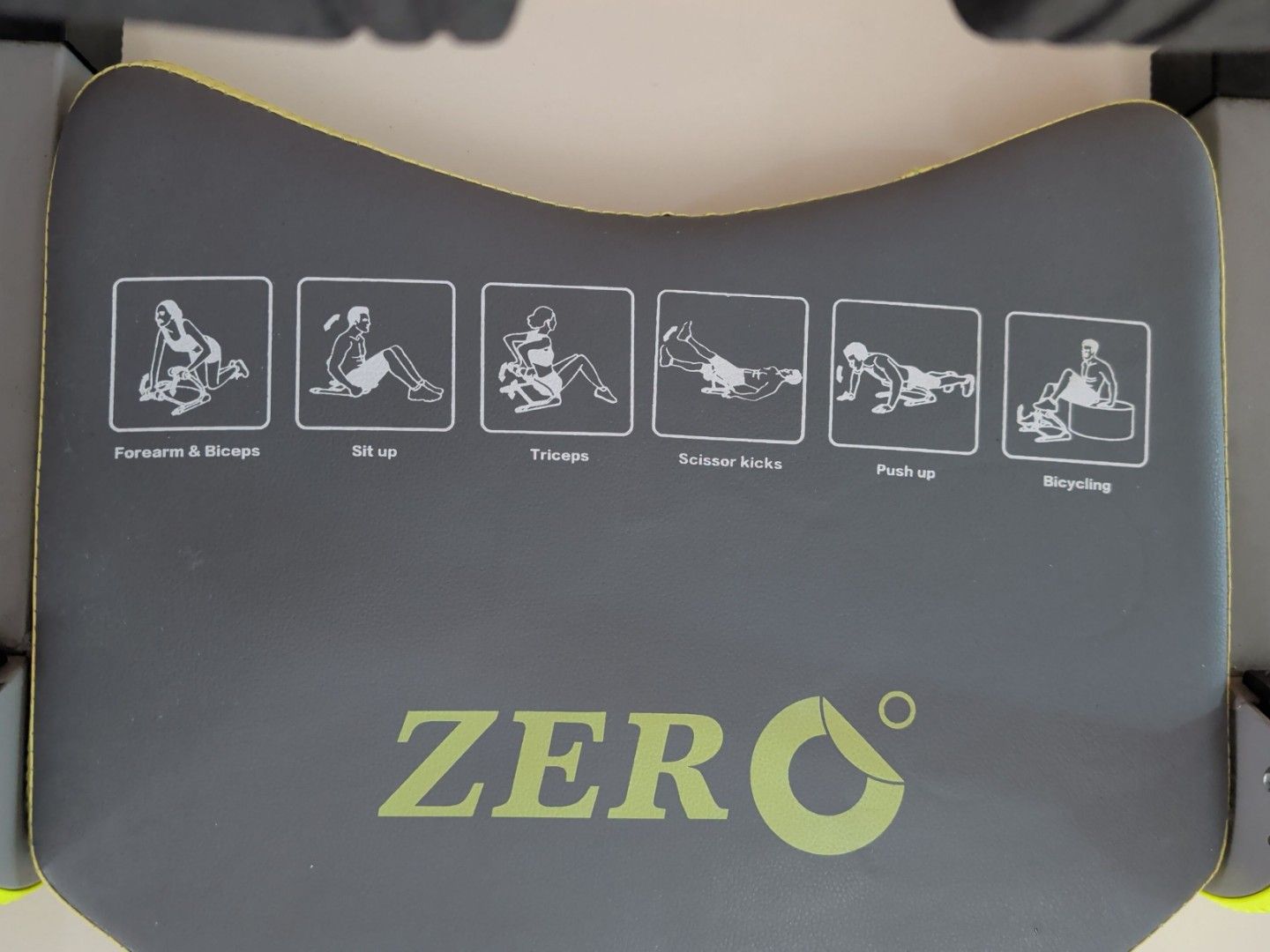 Zero Exercise Machine - Abdominal Workout (Category: Cardio & Fitness Machines) located in Singapore. Submitted by kuriomeow (Listing ID 1420237921, Image 3). Description: Zero exercise machine is designed for abdominal workouts. It features padded handles and a comfortable seat. The machine has illustrations for various exercises, including bicycling, push-ups, and sit-ups..
