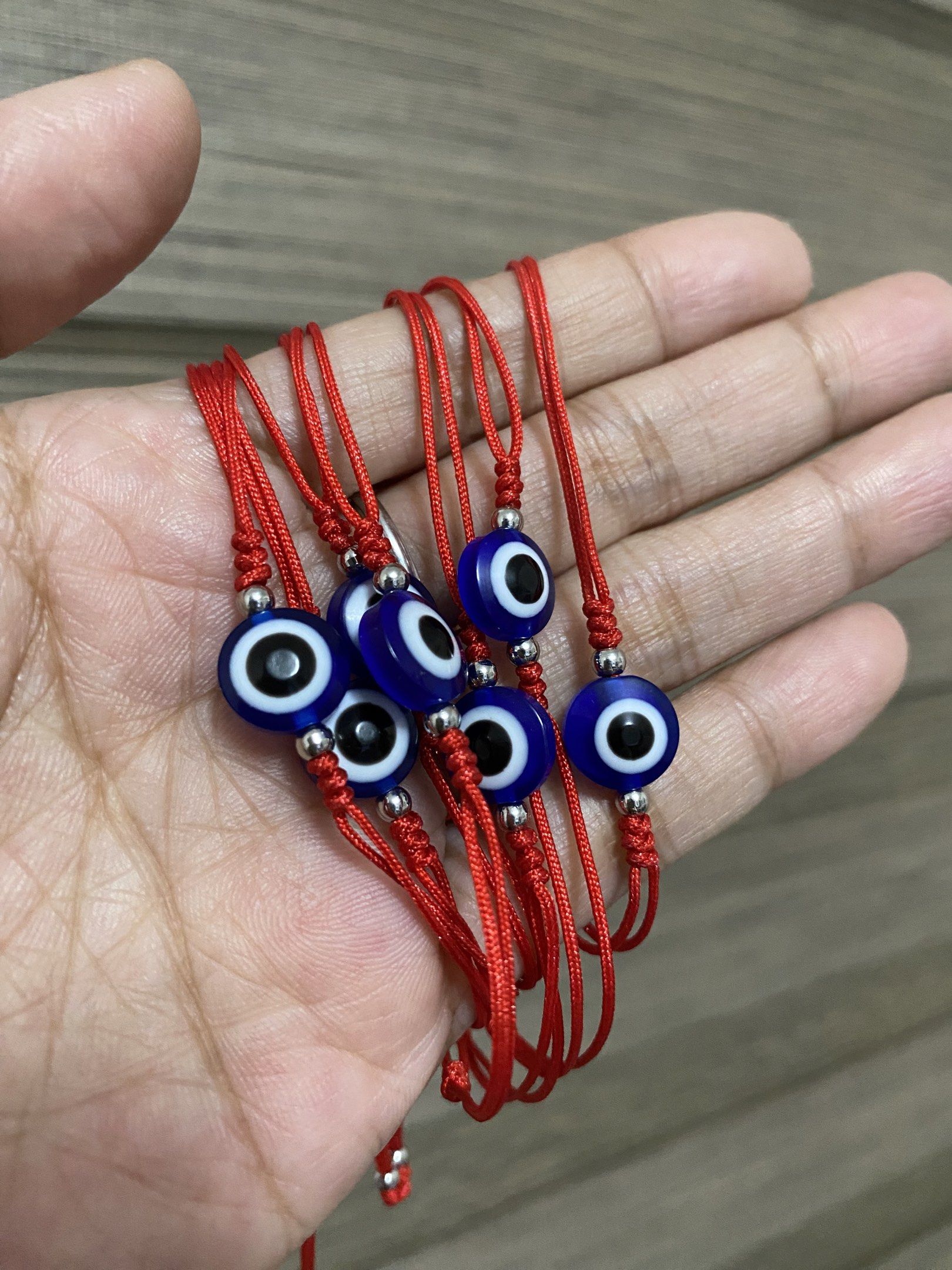 10mm Evil Eye Bracelets (stainless bead spacer) (Category: Bracelets) located in General Trias. Submitted by artycles (Listing ID 1420350578, Image 3). Description: Available in red or navy blue strings - Adjustable red string bracelet - Features a blue evil eye charm - Fits most wrist sizes - Perfect for everyday wear - Can be worn alone or stacked - Believed to protect against negative energy.