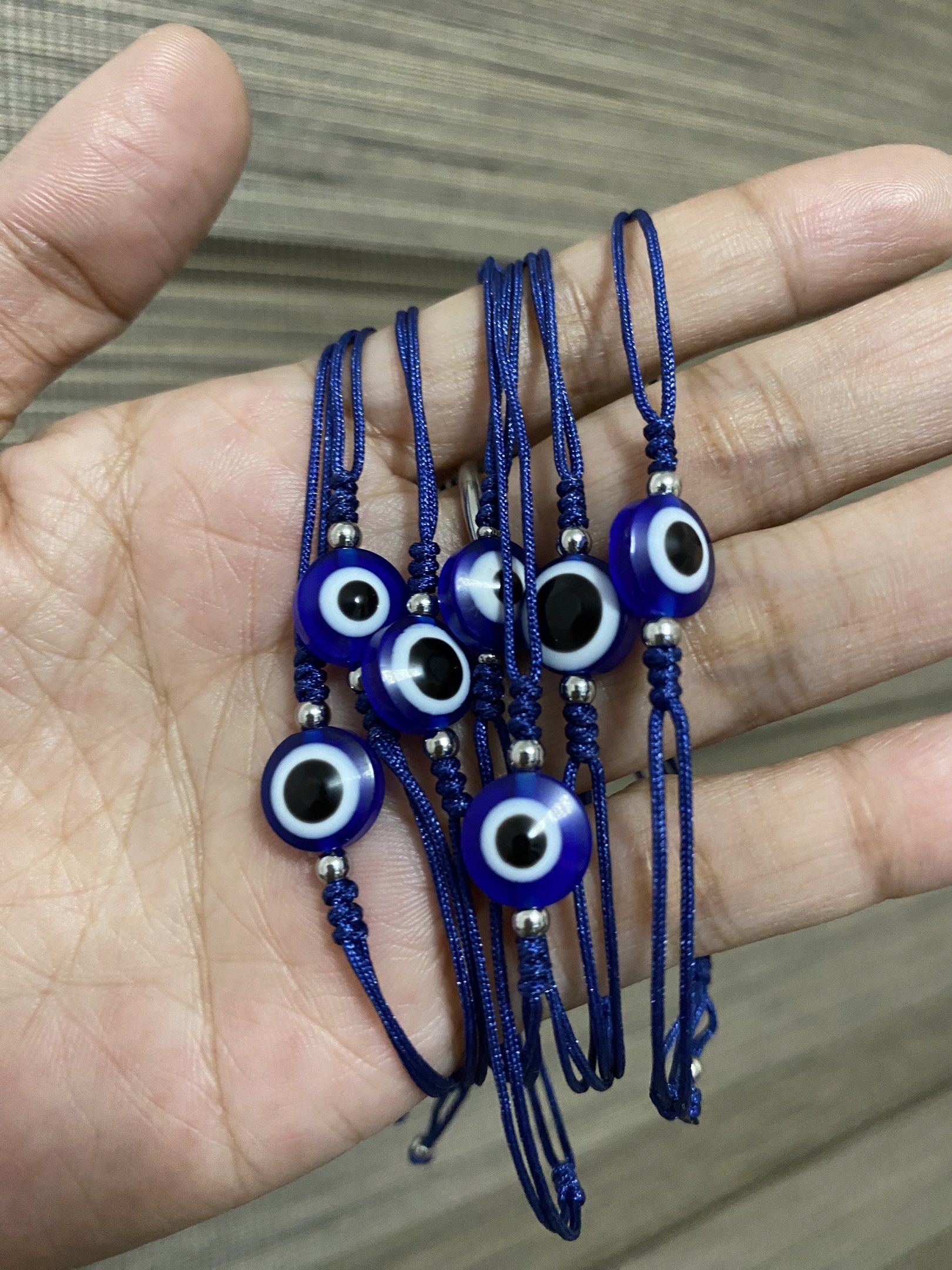10mm Evil Eye Bracelets (stainless bead spacer) (Category: Bracelets) located in General Trias. Submitted by artycles (Listing ID 1420350578, Image 2). Description: Available in red or navy blue strings - Adjustable red string bracelet - Features a blue evil eye charm - Fits most wrist sizes - Perfect for everyday wear - Can be worn alone or stacked - Believed to protect against negative energy.