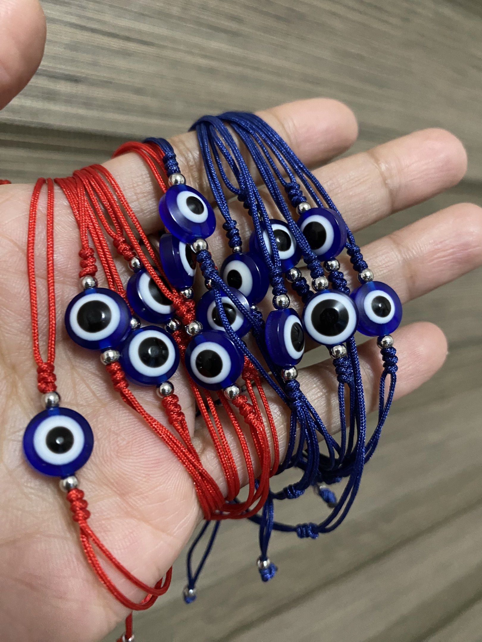 10mm Evil Eye Bracelets (stainless bead spacer) (Category: Bracelets) located in General Trias. Submitted by artycles (Listing ID 1420350578, Image 1). Description: Available in red or navy blue strings - Adjustable red string bracelet - Features a blue evil eye charm - Fits most wrist sizes - Perfect for everyday wear - Can be worn alone or stacked - Believed to protect against negative energy.