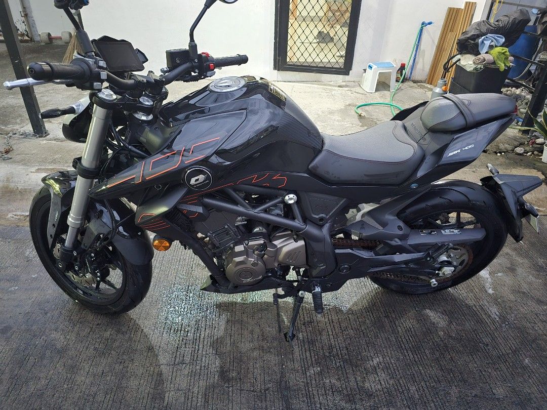 2025 QJ Motor SRK 400 Motorcycle (Category: Motorbikes for Sale) located in Makati City. Submitted by iampinarello651 (Listing ID 1420466833, Image 2). Description: 2025 QJ Motor SRK 400 Naked Bike - 400cc 2 cylinder 360° crankshaft with deep and crisp like inline 3 sound - DOHC 8 valves - 40.9 HP, 37 NM Torque - Dual channel ABS with traction control - 13.5 L tank - 5 inches TFT digital instrument cluster with indiglo switches - 4k km odo only -