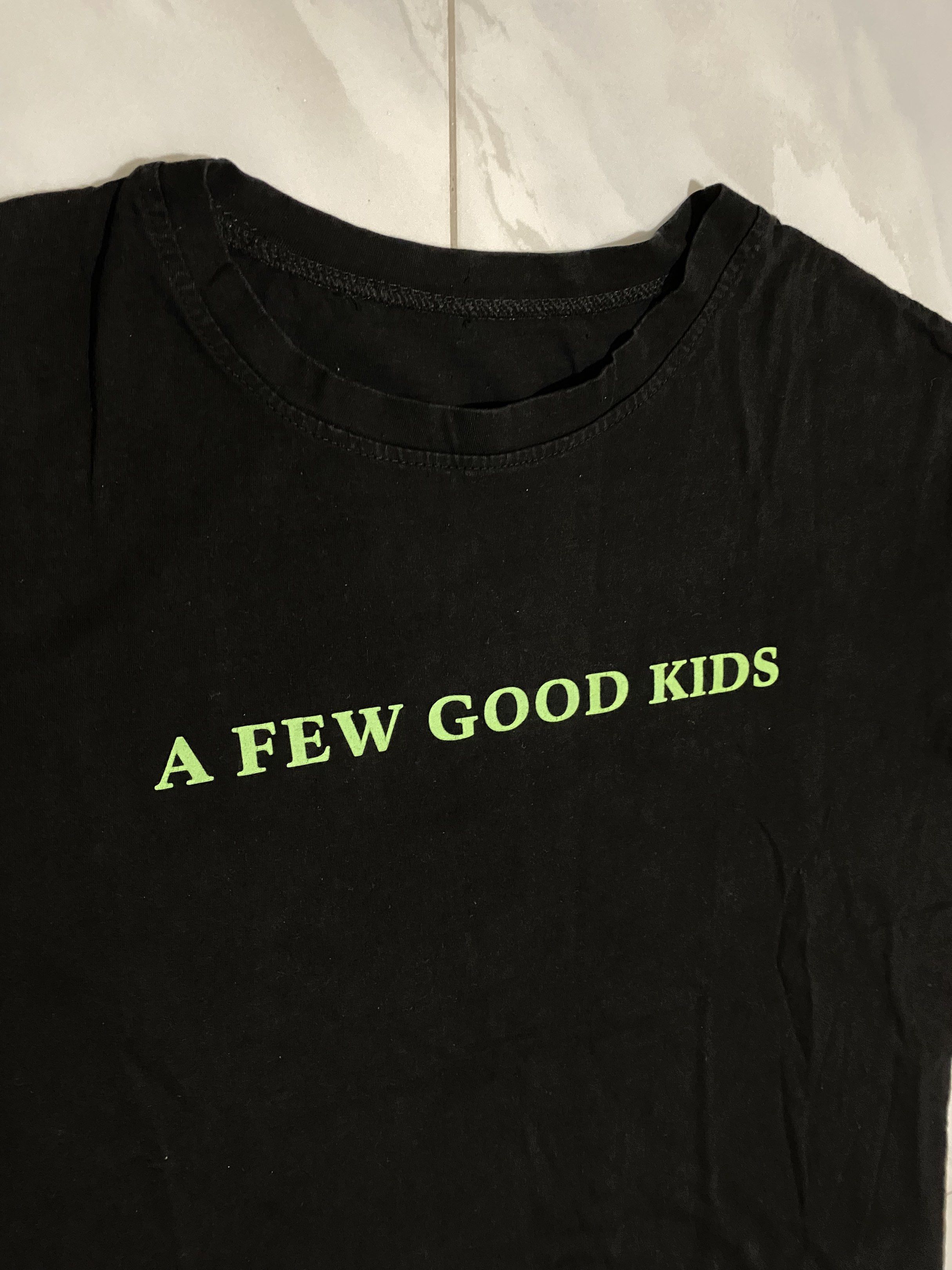 A Few Good Kids Black Tee (Category: Tshirts & Polo Shirts ) located in Kalibo. Submitted by migz_ (Listing ID 1420387562, Image 3). Description: Dimes - 22x25 Condition - 9/10 Color Rate - 8.5-9/10 Issue - cut tags, minimal hairlines.