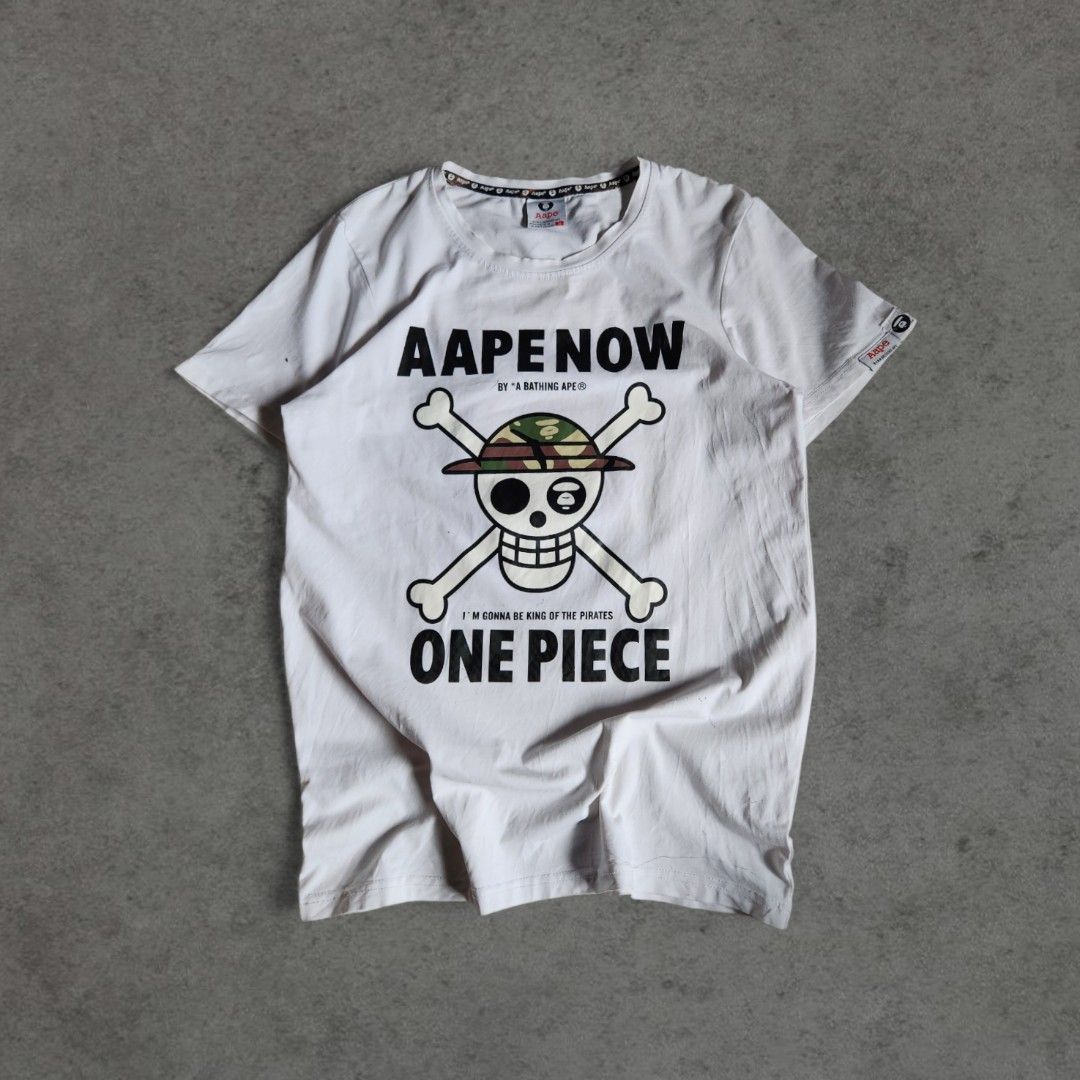 AAPE x One Piece T-shirt (Category: Tshirts & Polo Shirts ) located in Balanga. Submitted by sift.thrift8 (Listing ID 1420405461, Image 1). Description: AAPE x One Piece T-shirt. 18 × 24 Color rate: 10/10 Issue: pen ink (washable) .