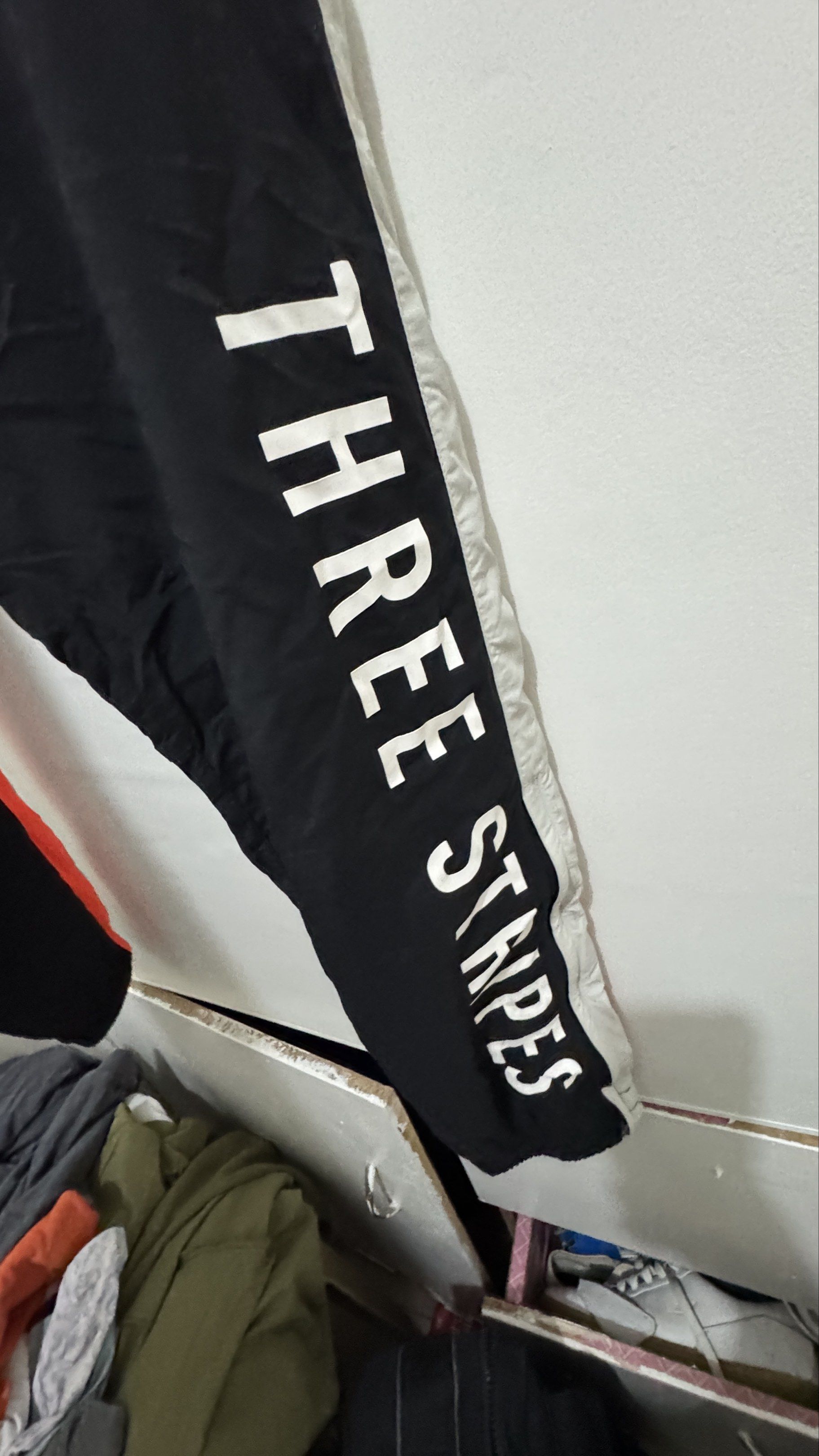 Adidas Track Pants - Black with Orange Stripes (Category: Joggers) located in Manila. Submitted by offthehype (Listing ID 1420442071, Image 3). Description: - Adidas track pants - Color: Black with orange and grey stripes - Size: L - Features Adidas logo - "THREE STRIPES" printed on side - Drawstring waist - Mesh lining - Material: 100% nylon (body), 100% polyester (lining) If set kukunin I can give it 1800 for the set.