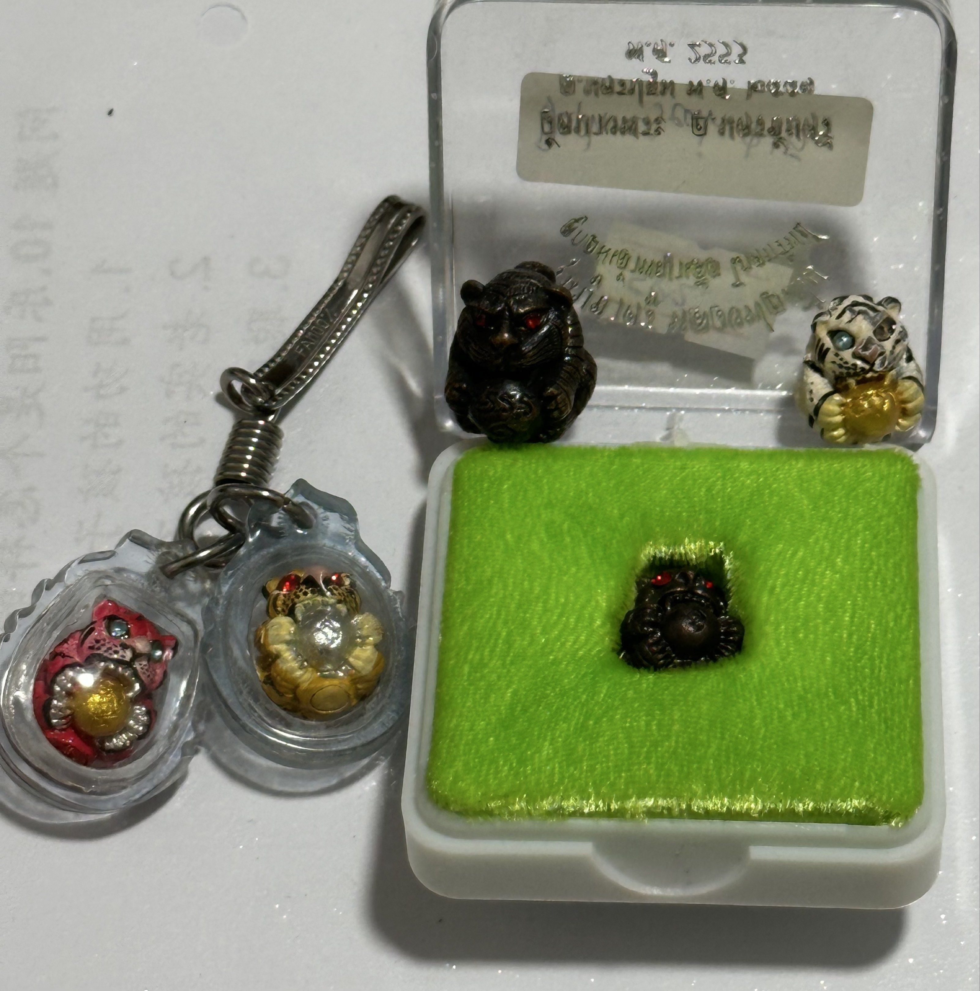 Amulets (Category: Religious Items) located in Singapore. Submitted by thetriftloom_owl (Listing ID 1420467821, Image 6). Description: - Assortment of amulets. - Diverse designs and shapes. - Various materials used. - Some amulets are encased. - Well-preserved condition. - total 50 plus amulets together with 1st listing..