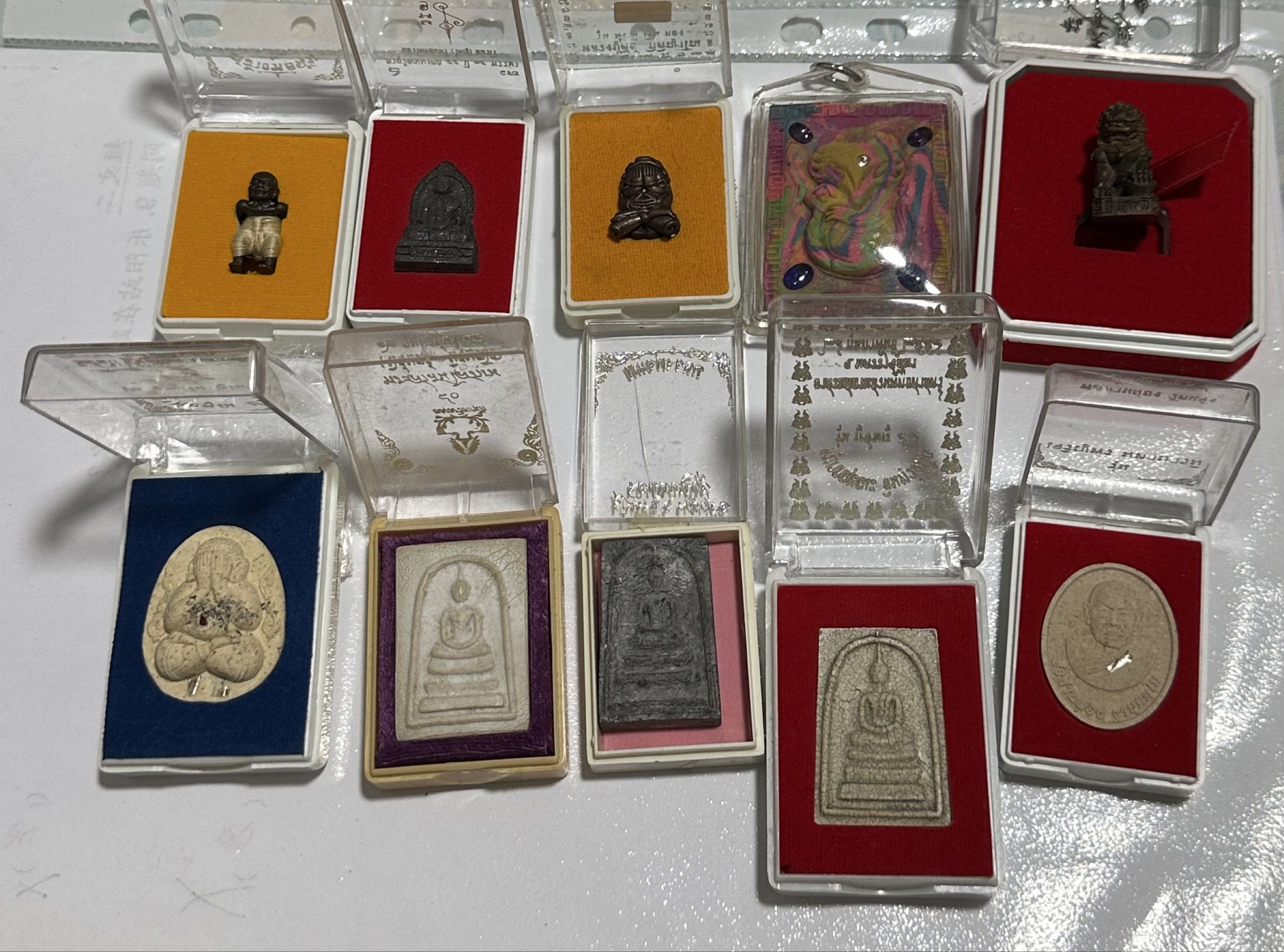 Amulets (Category: Religious Items) located in Singapore. Submitted by thetriftloom_owl (Listing ID 1420467821, Image 5). Description: - Assortment of amulets. - Diverse designs and shapes. - Various materials used. - Some amulets are encased. - Well-preserved condition. - total 50 plus amulets together with 1st listing..