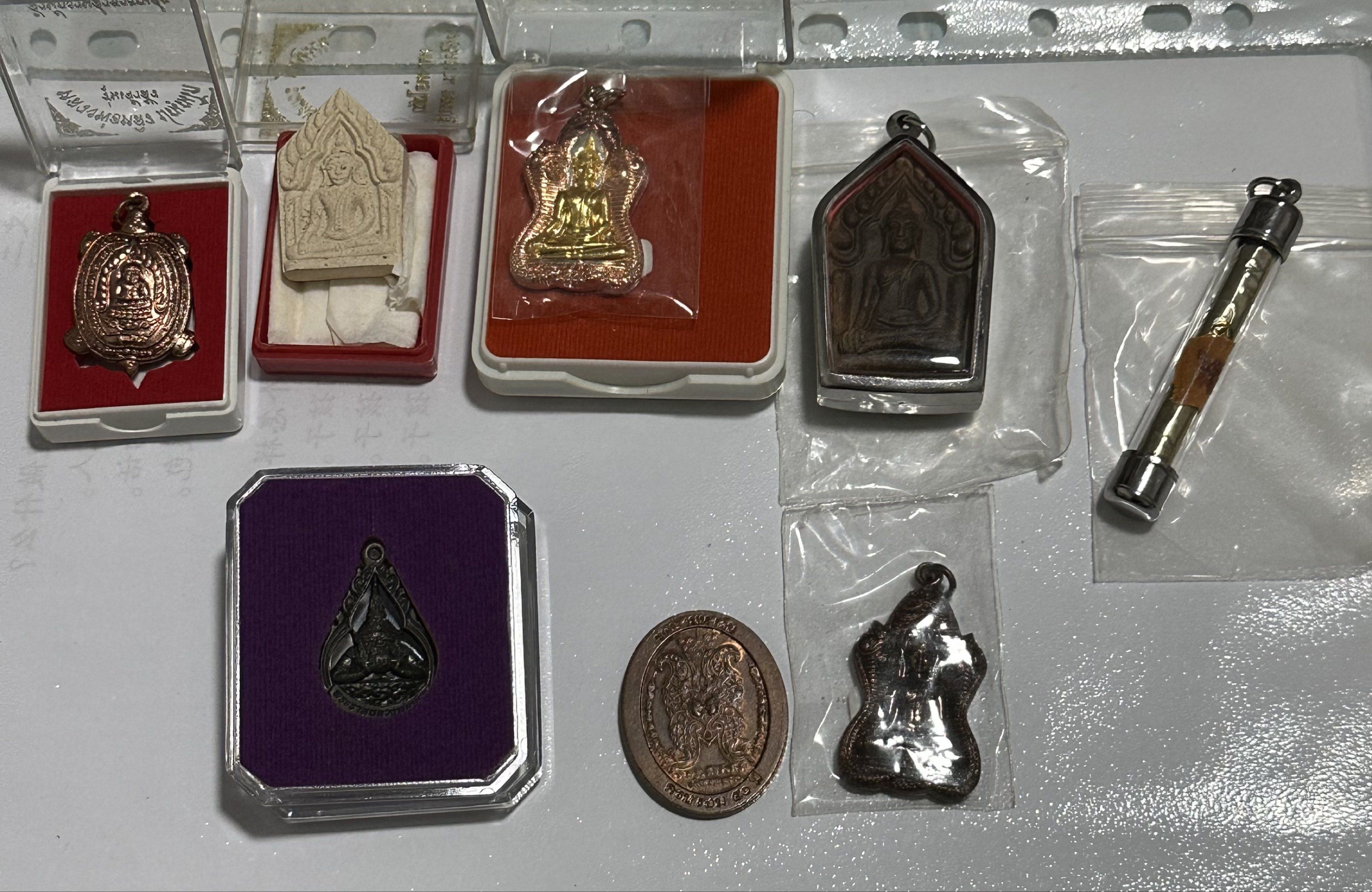 Amulets (Category: Religious Items) located in Singapore. Submitted by thetriftloom_owl (Listing ID 1420467821, Image 3). Description: - Assortment of amulets. - Diverse designs and shapes. - Various materials used. - Some amulets are encased. - Well-preserved condition. - total 50 plus amulets together with 1st listing..