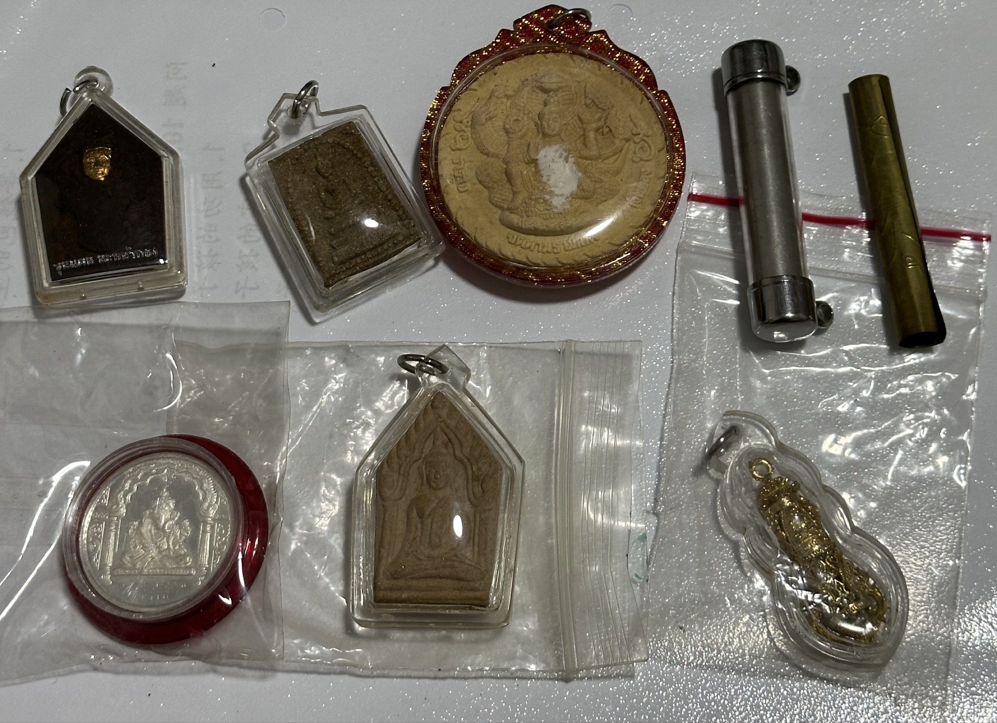 Amulets (Category: Religious Items) located in Singapore. Submitted by thetriftloom_owl (Listing ID 1420467821, Image 7). Description: - Assortment of amulets. - Diverse designs and shapes. - Various materials used. - Some amulets are encased. - Well-preserved condition. - total 50 plus amulets together with 1st listing..