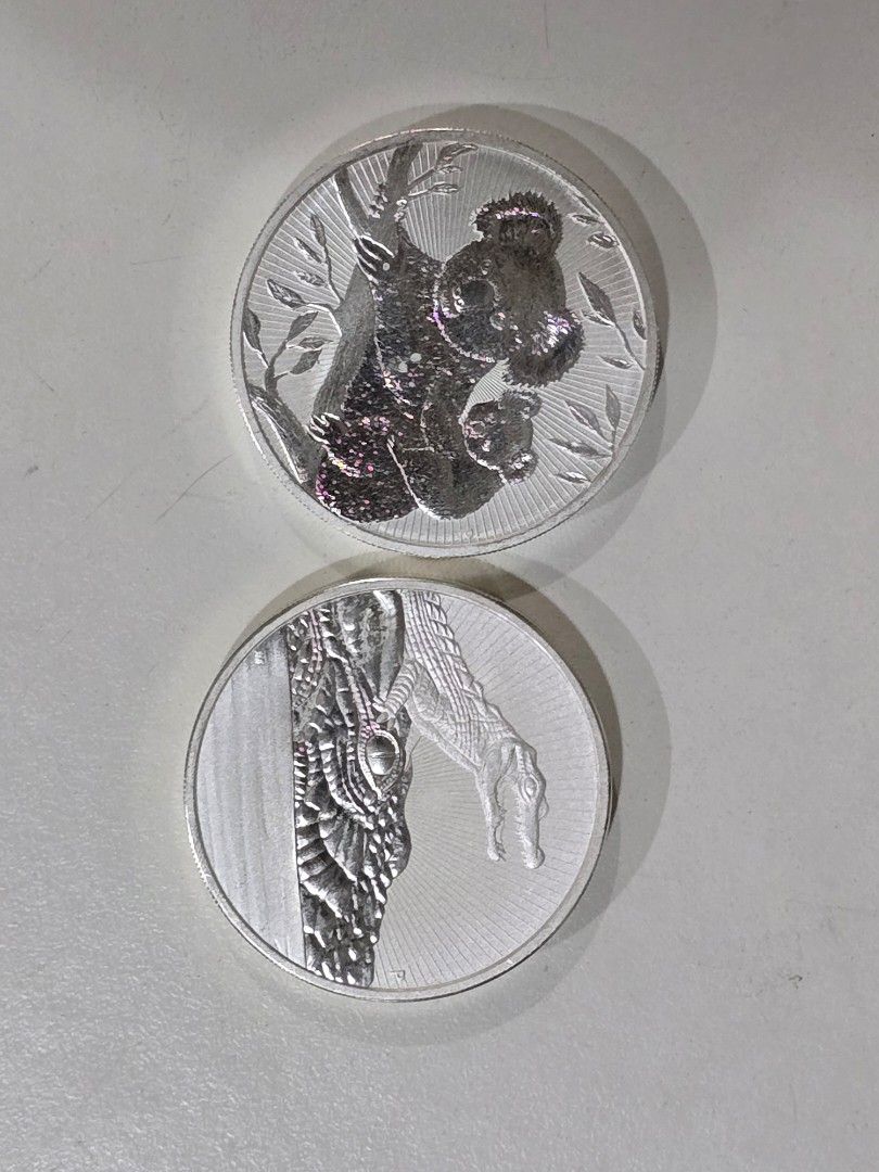 Australian Silver Coins - Koala and Crocodile (Category: Currency) located in Dasmarinas. Submitted by ildnumde (Listing ID 1420531328, Image 1). Description: - Two Australian silver coins 2oz each - Features: Koala with baby and Crocodile with baby - Includes portrait of Queen Elizabeth II - Years: 2013 and 2019.
