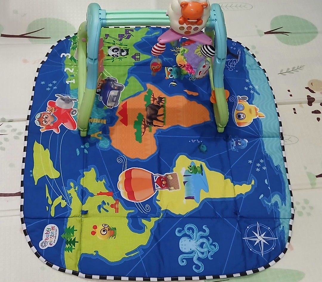 Baby Einstein Play Gym (Category: Infant Playtime) located in Manila. Submitted by dories12d57986 (Listing ID 1420542531, Image 1). Description: - Baby Einstein play gym with a colorful world map design. - Features an overhead arch with hanging toys. - Comes with a soft, padded mat. - Mat includes illustrations of animals, vehicles, and landmarks. - Designed to stimulate baby's senses and encourage exploration. - Suitable for infants and young ba