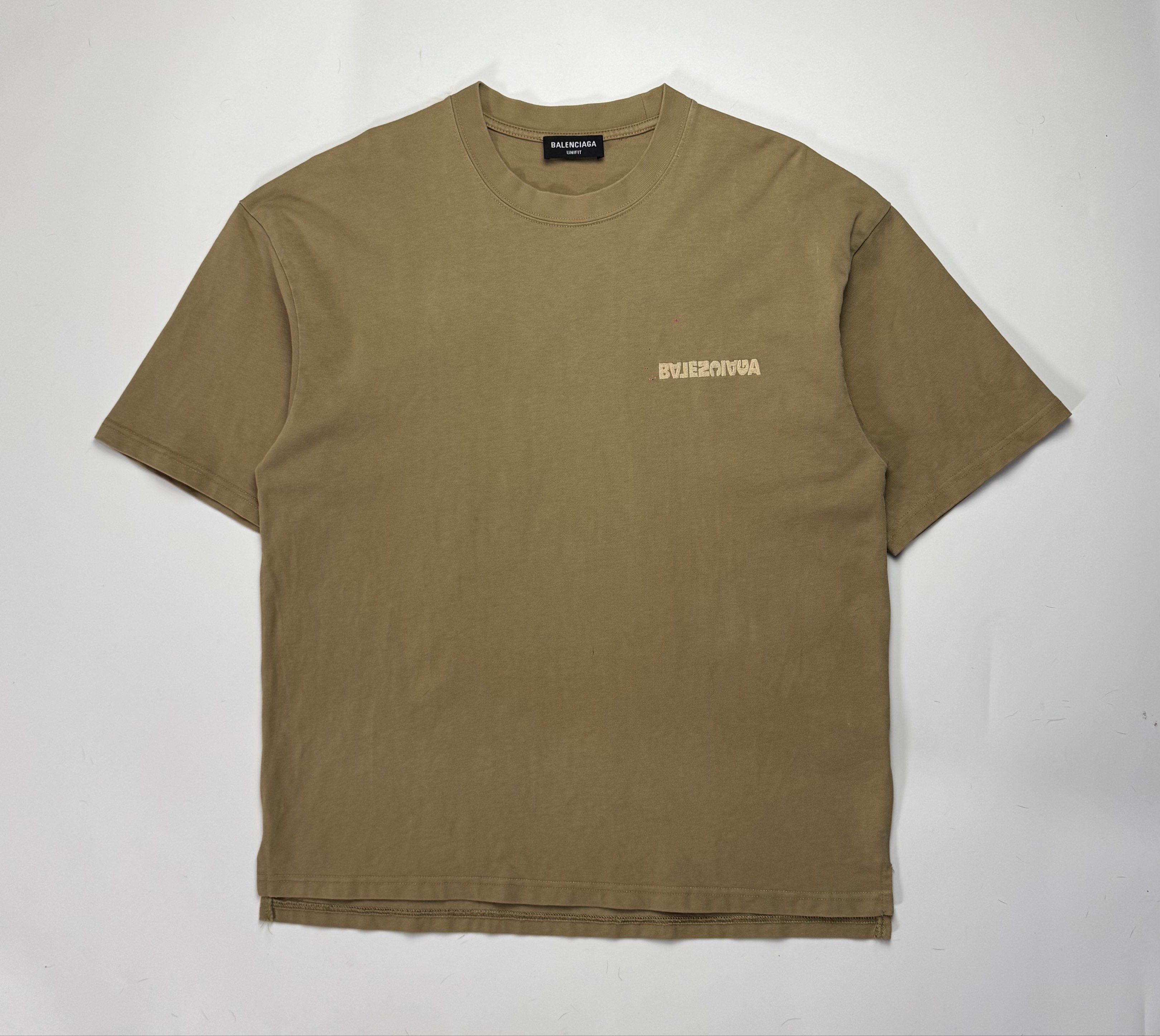 Balenciaga Simple Logo T-shirt (Category: Tshirts & Polo Shirts ) located in Caloocan City. Submitted by opulent.finds (Listing ID 1420533251, Image 1). Description: - Balenciaga T-shirt - Color: Muted Brown - Design: Front and mirrored back logo - Neckline: Crew neck - Sleeves: Short sleeves - Authentic Balenciaga logo on neckline.