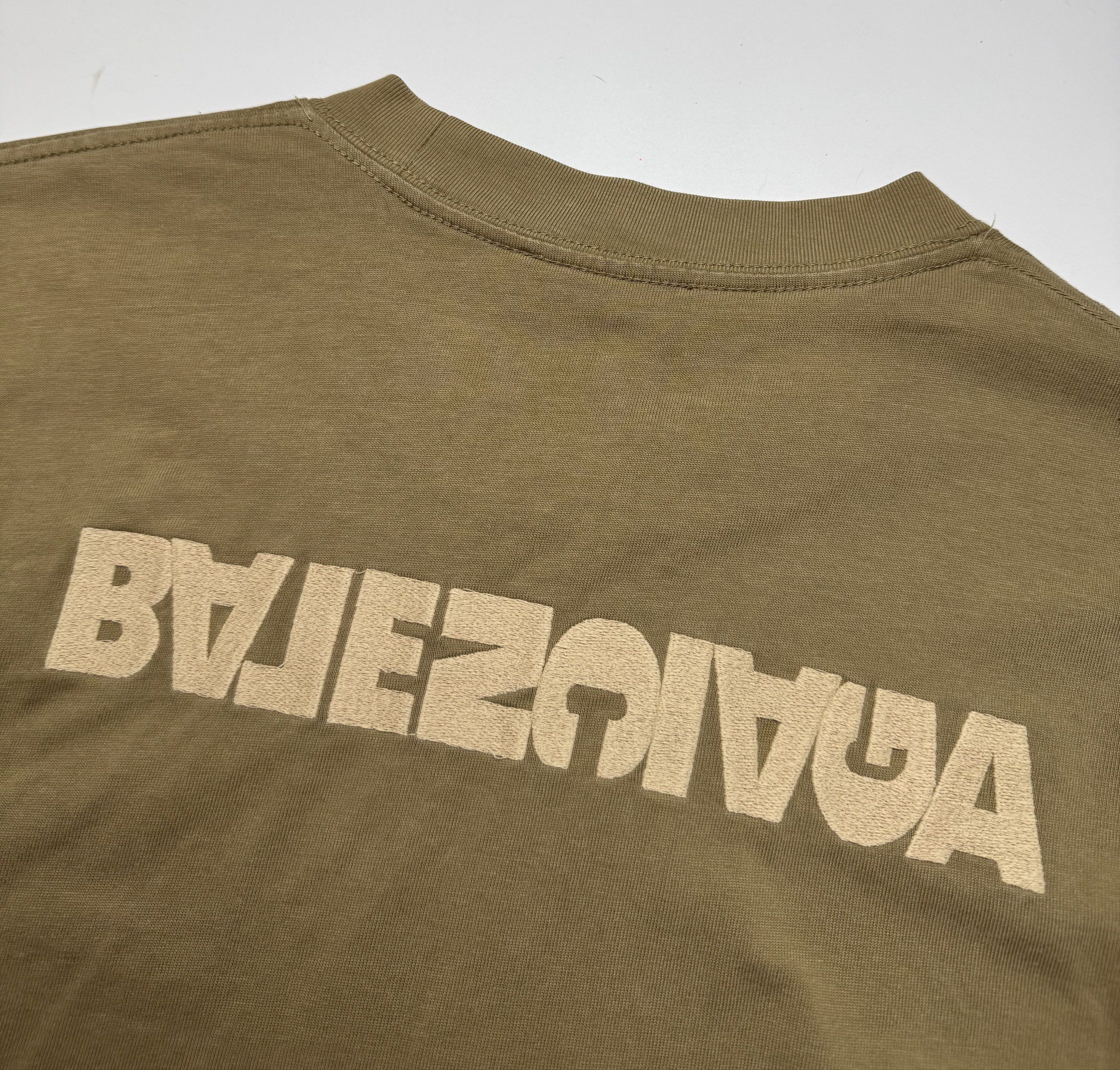 Balenciaga Simple Logo T-shirt (Category: Tshirts & Polo Shirts ) located in Caloocan City. Submitted by opulent.finds (Listing ID 1420533251, Image 3). Description: - Balenciaga T-shirt - Color: Muted Brown - Design: Front and mirrored back logo - Neckline: Crew neck - Sleeves: Short sleeves - Authentic Balenciaga logo on neckline.