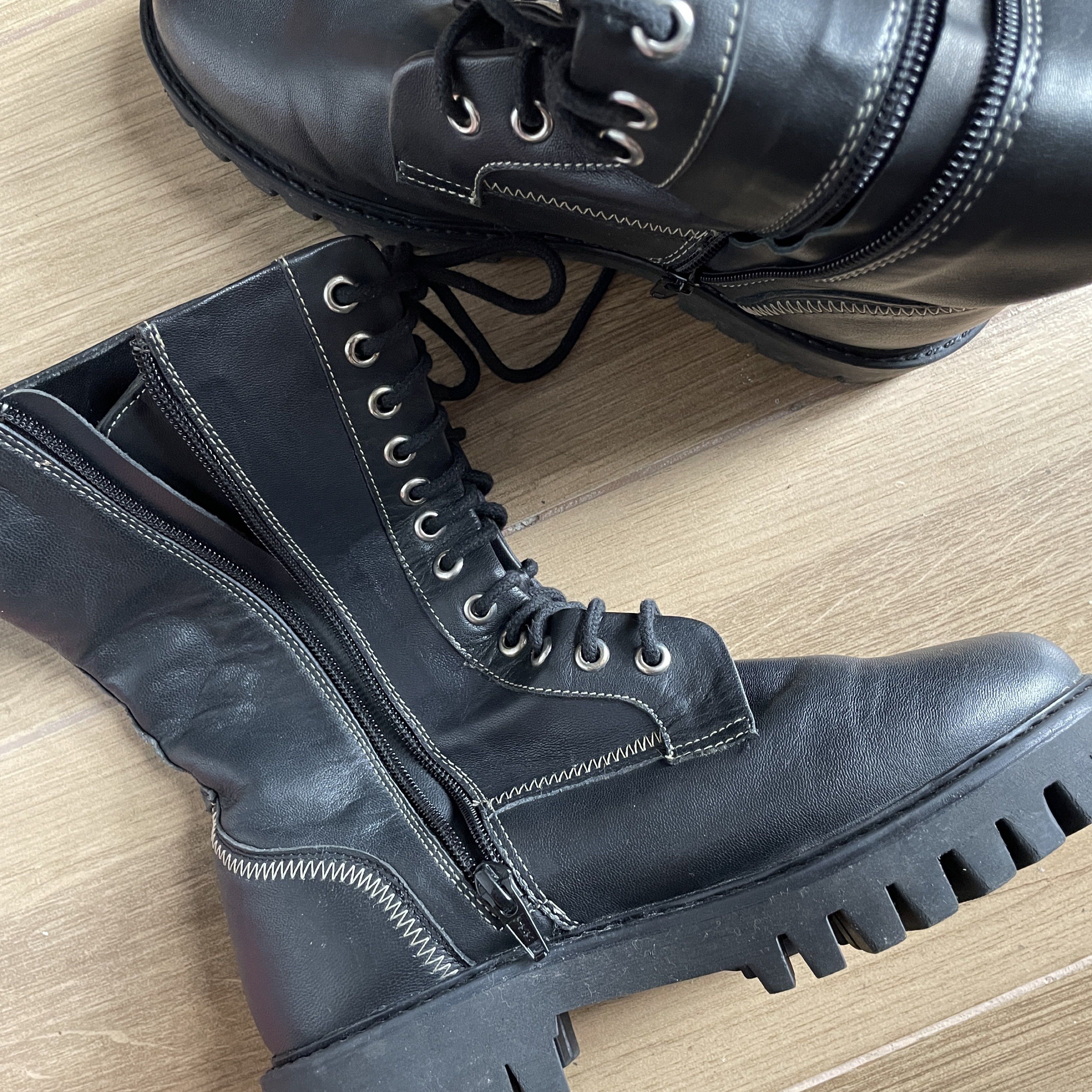 Size 7 Leather Black Combat Boots with Side Zipper (Category: Boots) located in Cavite. Submitted by theseventhph (Listing ID 1420374218, Image 2). Description: - Black combat boots - Chunky sole - Lace-up closure - Side zipper for easy wear - Mid-calf height - Round toe - Leather - Size 7, best fits size 6-6.5 if you’re using socks. Medyo shug na if may thick socks for a size 7 like me - Used once during our Japan trip, no visible scratches or d