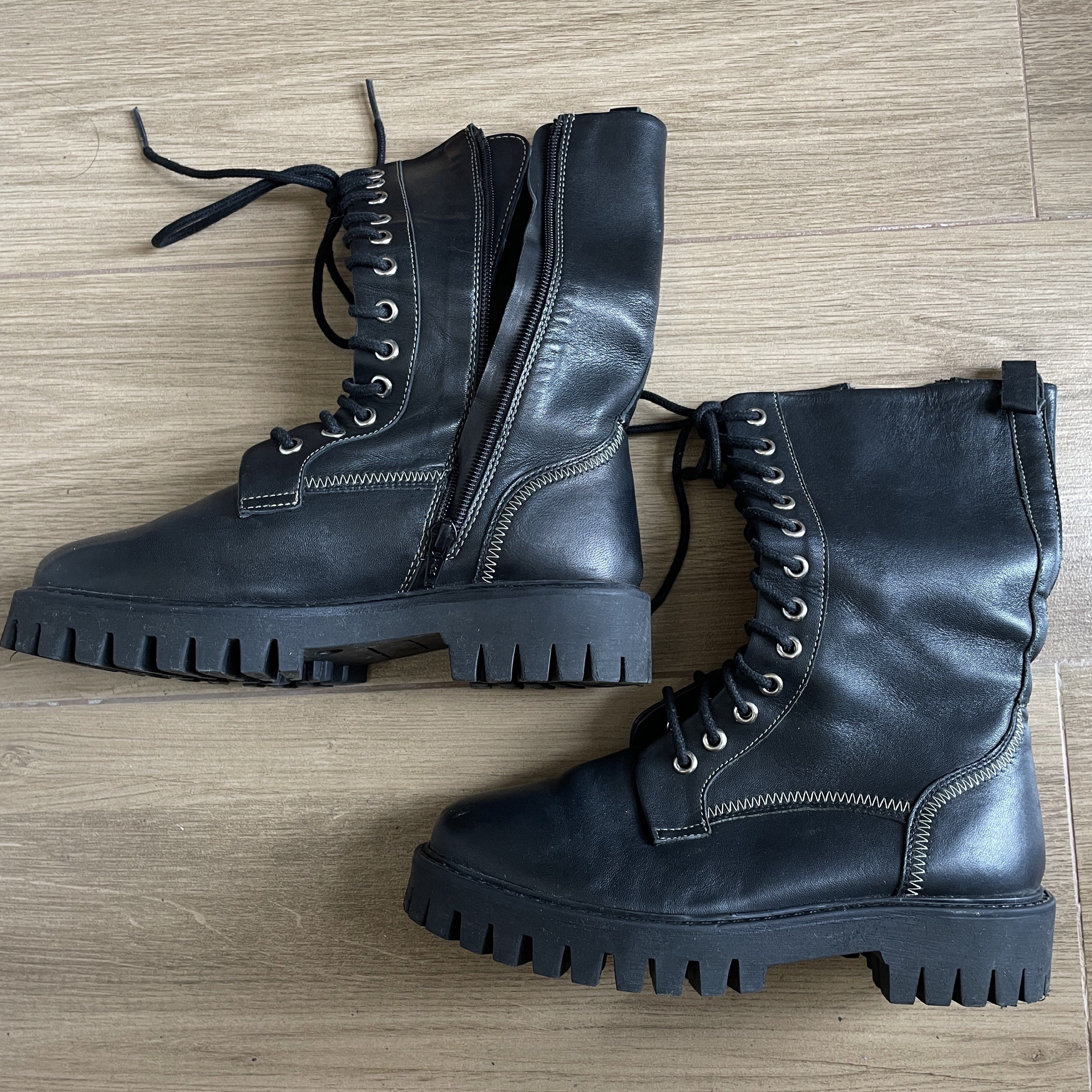 Size 7 Leather Black Combat Boots with Side Zipper (Category: Boots) located in Cavite. Submitted by theseventhph (Listing ID 1420374218, Image 1). Description: - Black combat boots - Chunky sole - Lace-up closure - Side zipper for easy wear - Mid-calf height - Round toe - Leather - Size 7, best fits size 6-6.5 if you’re using socks. Medyo shug na if may thick socks for a size 7 like me - Used once during our Japan trip, no visible scratches or d