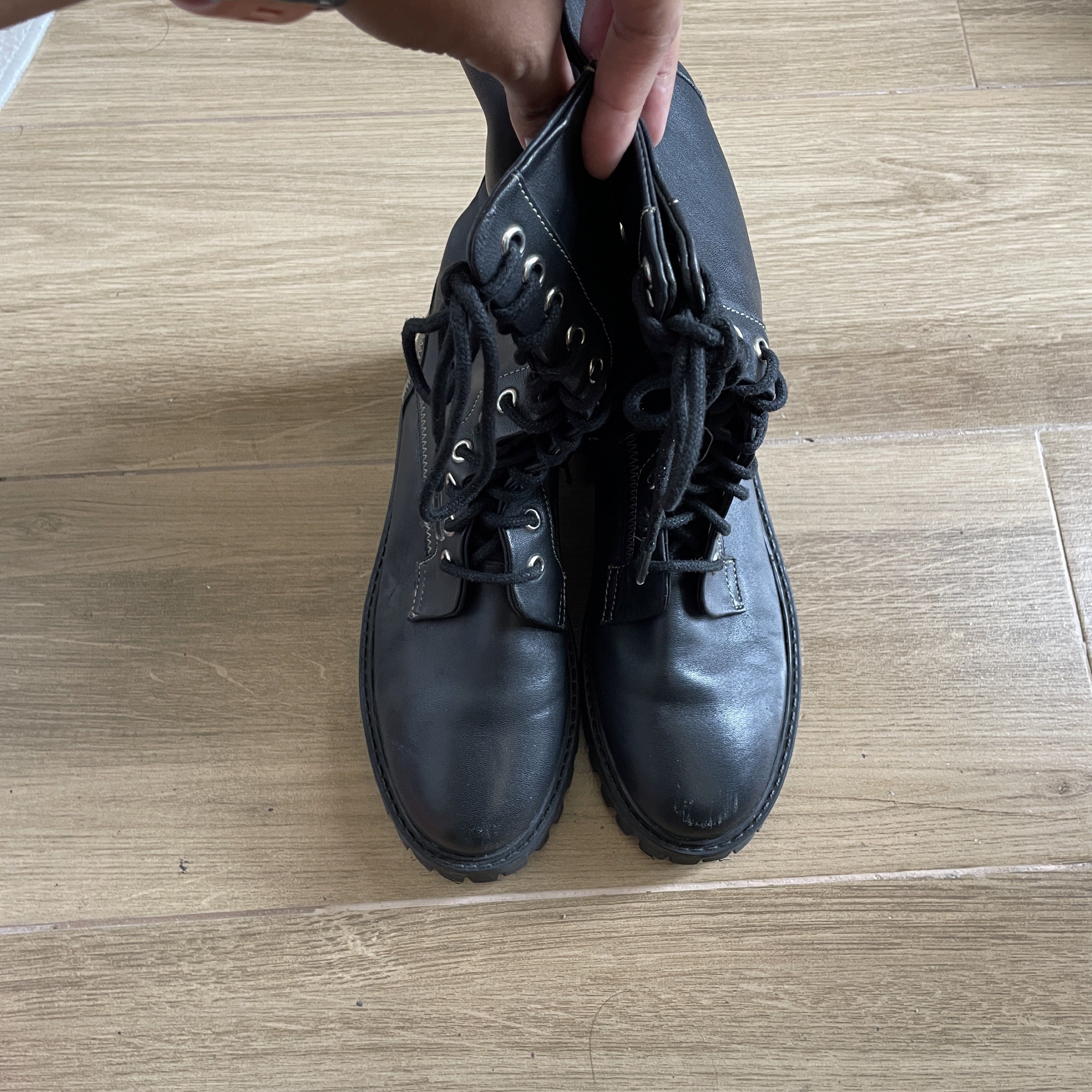 Size 7 Leather Black Combat Boots with Side Zipper (Category: Boots) located in Cavite. Submitted by theseventhph (Listing ID 1420374218, Image 3). Description: - Black combat boots - Chunky sole - Lace-up closure - Side zipper for easy wear - Mid-calf height - Round toe - Leather - Size 7, best fits size 6-6.5 if you’re using socks. Medyo shug na if may thick socks for a size 7 like me - Used once during our Japan trip, no visible scratches or d