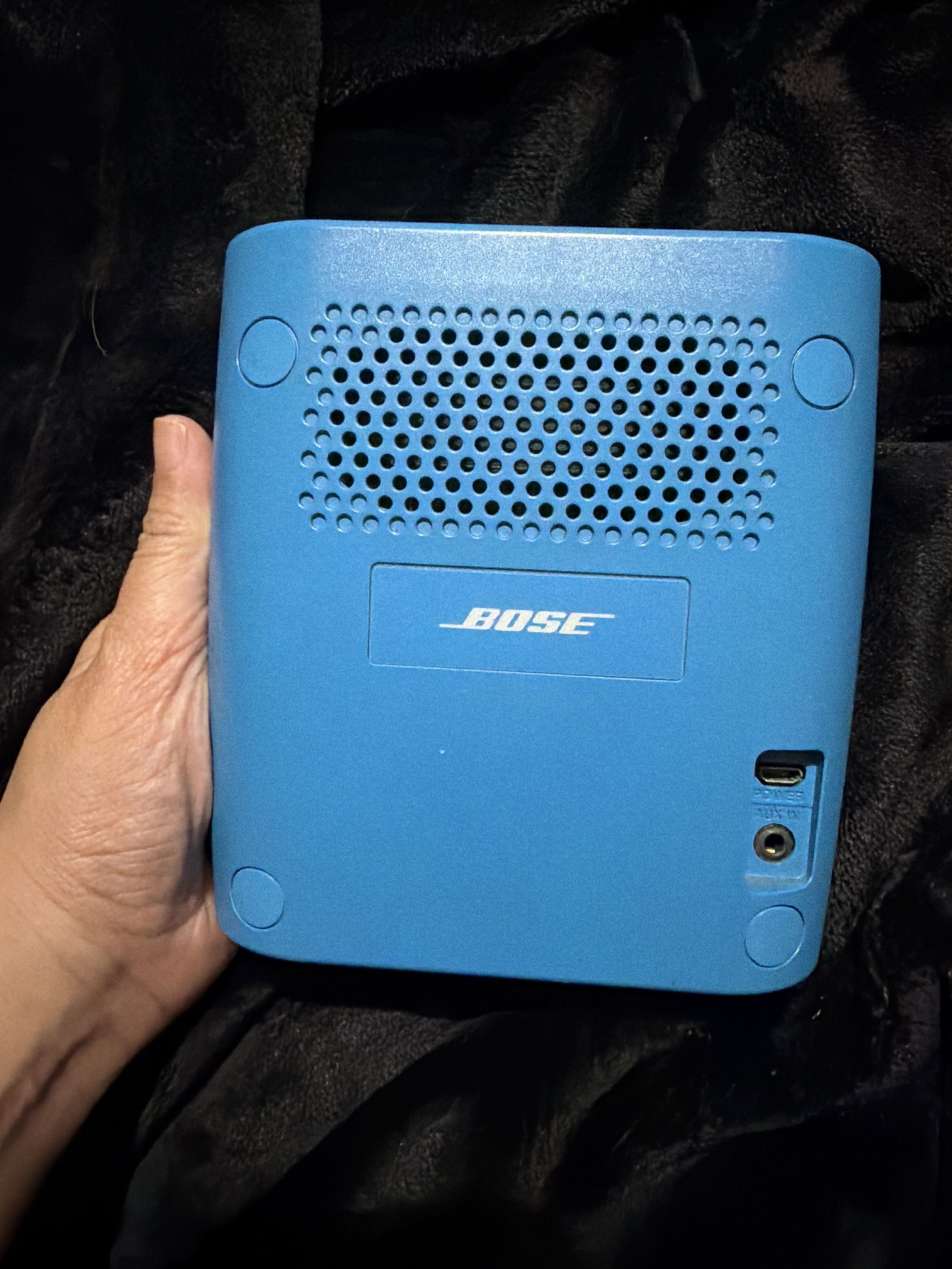 Bose SoundLink Color Bluetooth Speaker (Category: Soundbars, Speakers & Amplifiers) located in Manila. Submitted by pialoved (Listing ID 1420457425, Image 2). Description: - Blue Bose SoundLink Color Bluetooth speaker - Front and back speaker grill - Top controls: power, volume, playback - Ports: AUX, charging - Compact and portable design.