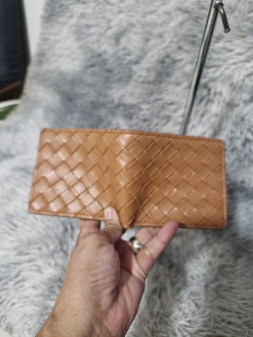 Bottega Veneta Woven Leather Wallet (Category: Luxury Bags & Wallets) located in San Fernando. Submitted by retzi_scollection (Listing ID 1420518345, Image 2). Description: - Authentic Bottega Veneta wallet - Woven leather design - Multiple card slots - Clear ID window - Made in Italy - Exterior: Dark brown - Interior: Lighter brown.