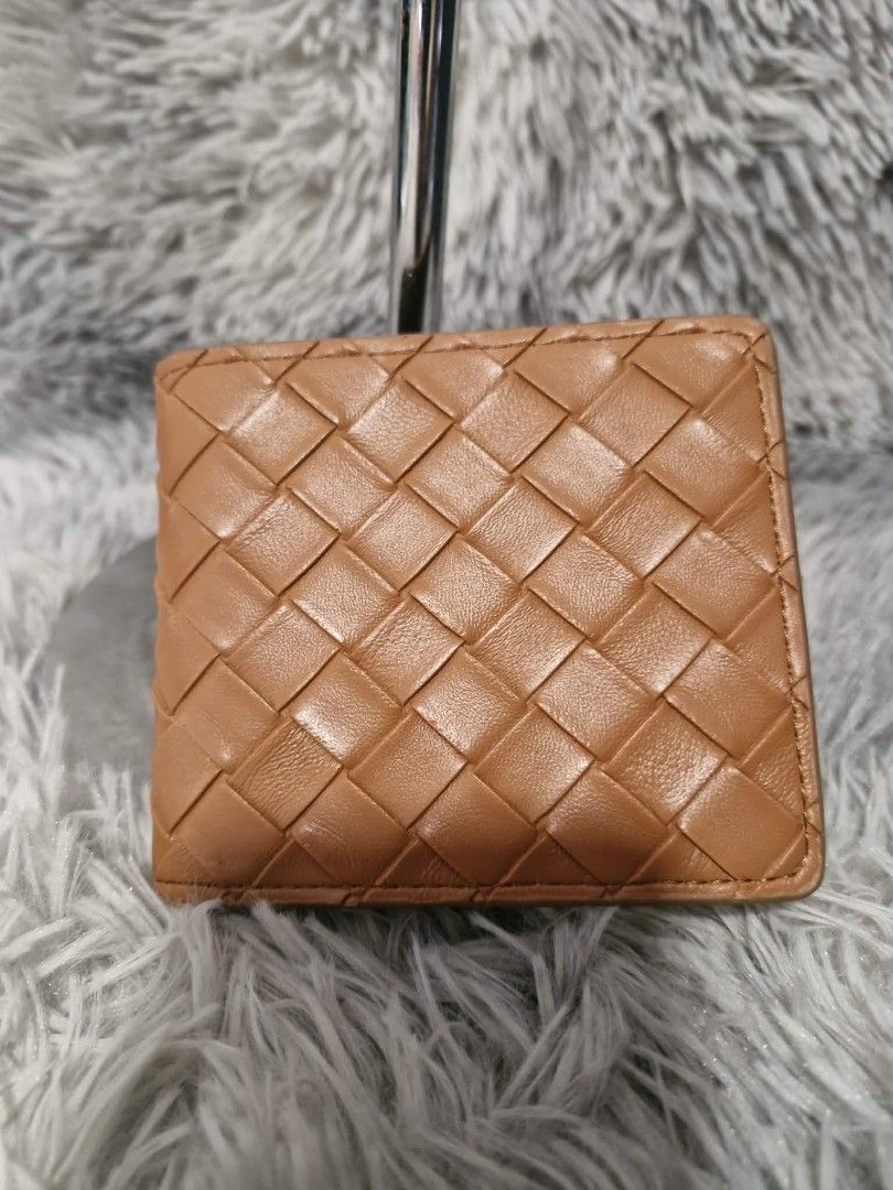 Bottega Veneta Woven Leather Wallet (Category: Luxury Bags & Wallets) located in San Fernando. Submitted by retzi_scollection (Listing ID 1420518345, Image 1). Description: - Authentic Bottega Veneta wallet - Woven leather design - Multiple card slots - Clear ID window - Made in Italy - Exterior: Dark brown - Interior: Lighter brown.