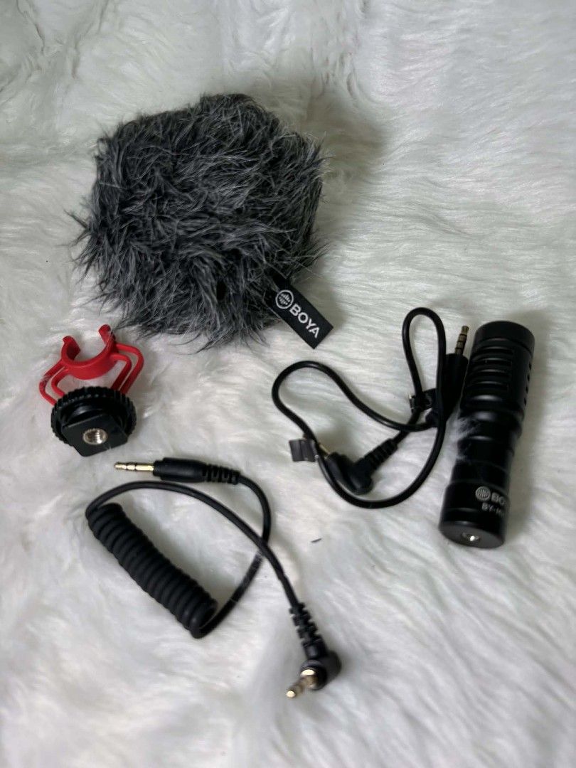 BOYA BY-MM1 Universal Cardioid Microphone (Category: Microphones) located in Rizal. Submitted by everythingfancy.ph (Listing ID 1420514458, Image 2). Description: - BOYA BY-MM1 Universal Cardioid Microphone - Includes: Microphone, furry windscreen, shock mount, and two connecting cables - Compatible with smartphones, cameras, and other devices - Color: Black microphone with a red shock mount - Comes with the original box.