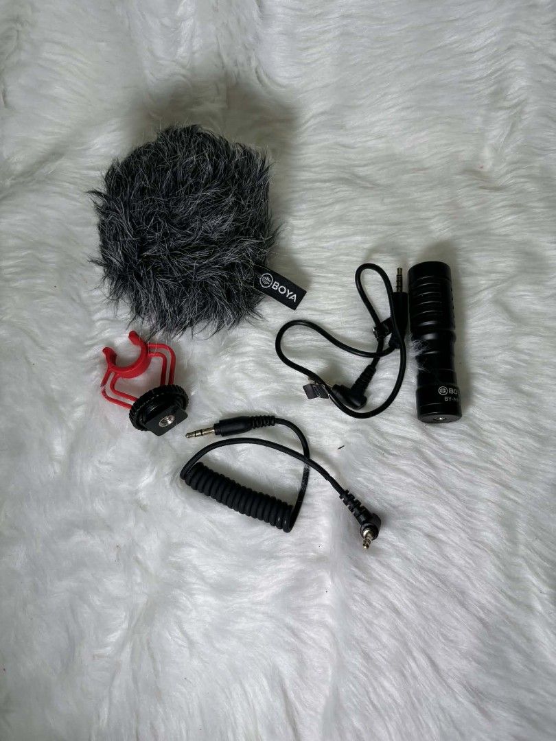BOYA BY-MM1 Universal Cardioid Microphone (Category: Microphones) located in Rizal. Submitted by everythingfancy.ph (Listing ID 1420514458, Image 3). Description: - BOYA BY-MM1 Universal Cardioid Microphone - Includes: Microphone, furry windscreen, shock mount, and two connecting cables - Compatible with smartphones, cameras, and other devices - Color: Black microphone with a red shock mount - Comes with the original box.