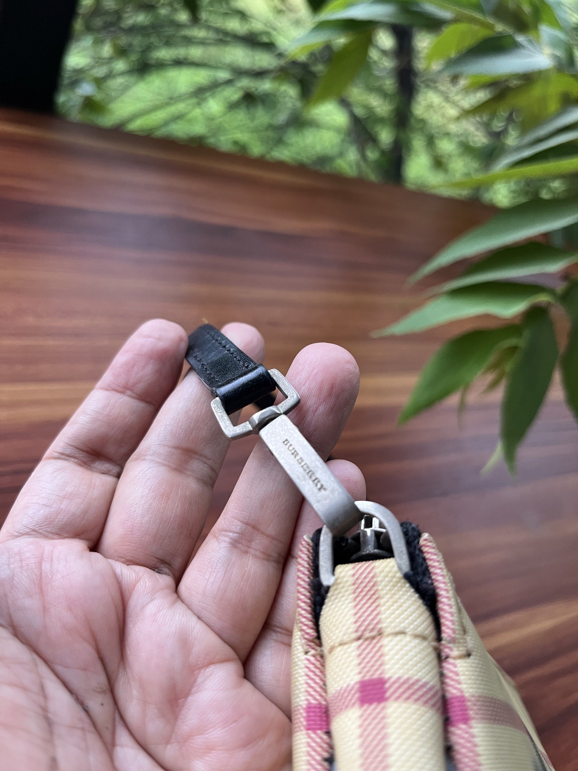 Burberry Checkered Handbag (Category: Luxury Bags & Wallets) located in Oroquieta. Submitted by mightyfalcon.f3b3e6 (Listing ID 1420482635, Image 2). Description: - Authentic Burberry handbag - Iconic checkered pattern - Black strap - Zipper closure - Black interior - Burberry logo hardware - YKK SPOT zipper markingi Issue:color transfer sa isang side-Painted already .