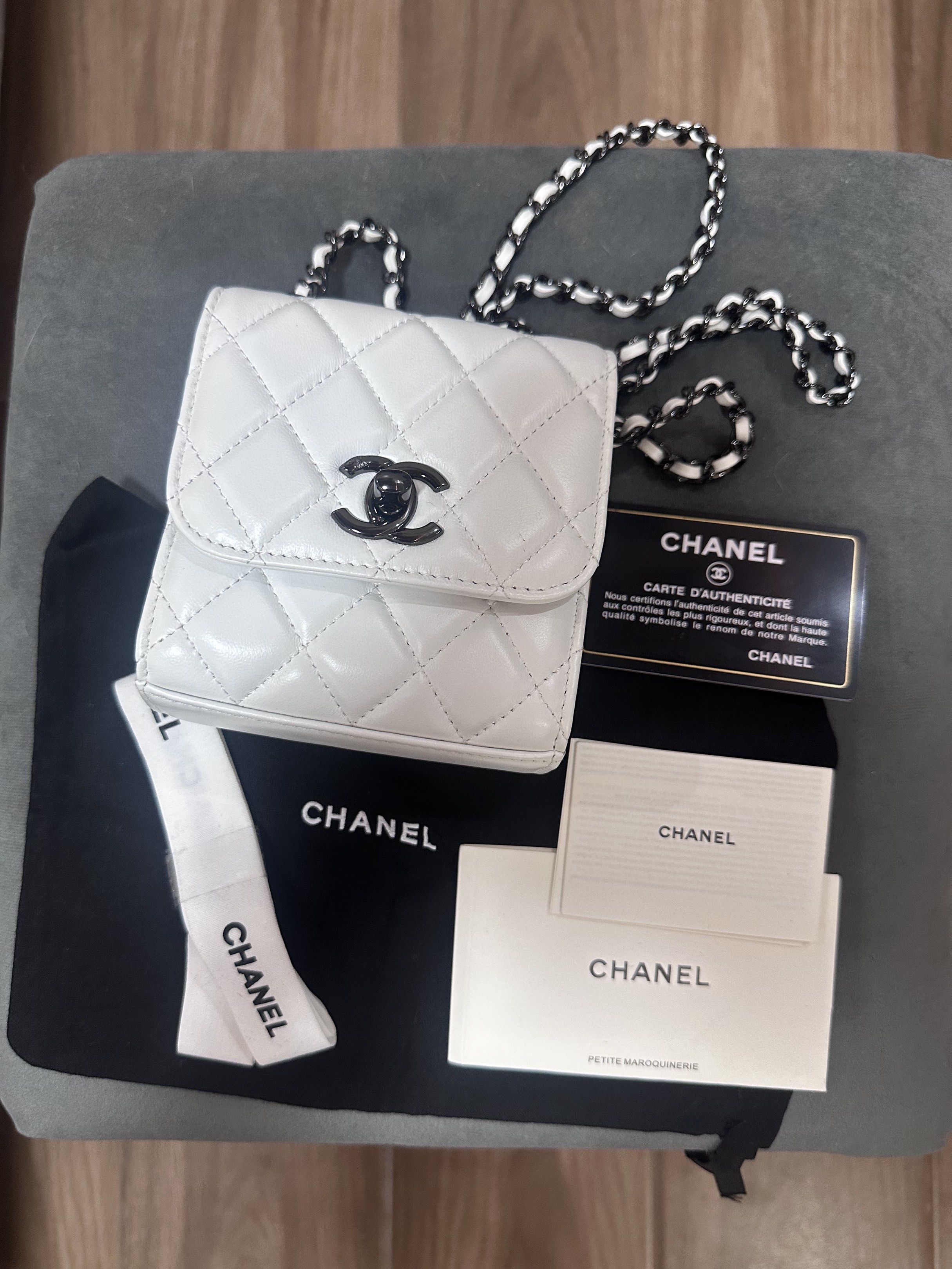 Chanel Mini Square Flap Bag White (Category: Luxury Bags & Wallets) located in Manila. Submitted by mavsthriftstore (Listing ID 1420397261, Image 1). Description: - mini square flap bag - Color: White - Classic quilted design - Chain strap - Black CC logo - Includes: Dust bag, authenticity card, and care booklet - Stylish and compact.