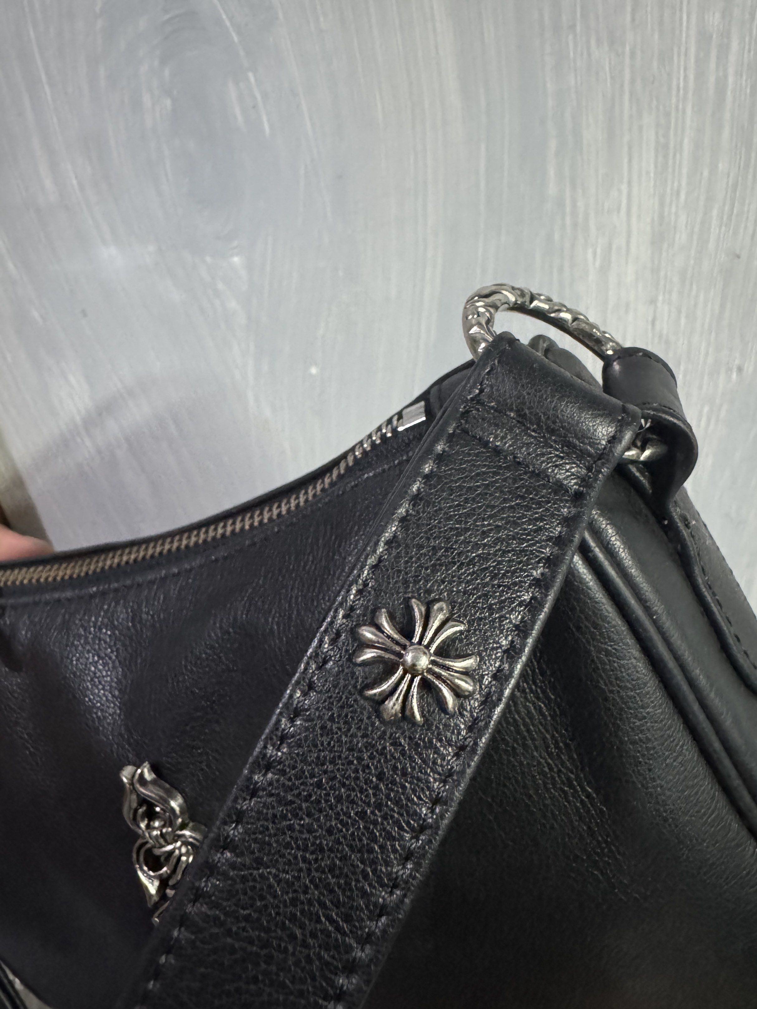 Chrome Hearts Black Leather Shoulder Bag (Category: Luxury Bags & Wallets) located in Manila. Submitted by dane18 (Listing ID 1420429949, Image 2). Description: - Black leather shoulder bag - Silver hardware - Chrome Hearts cross details - Dagger zipper pull - Top zipper closure - Shoulder strap - Lined interior - Chrome Hearts silver ring.